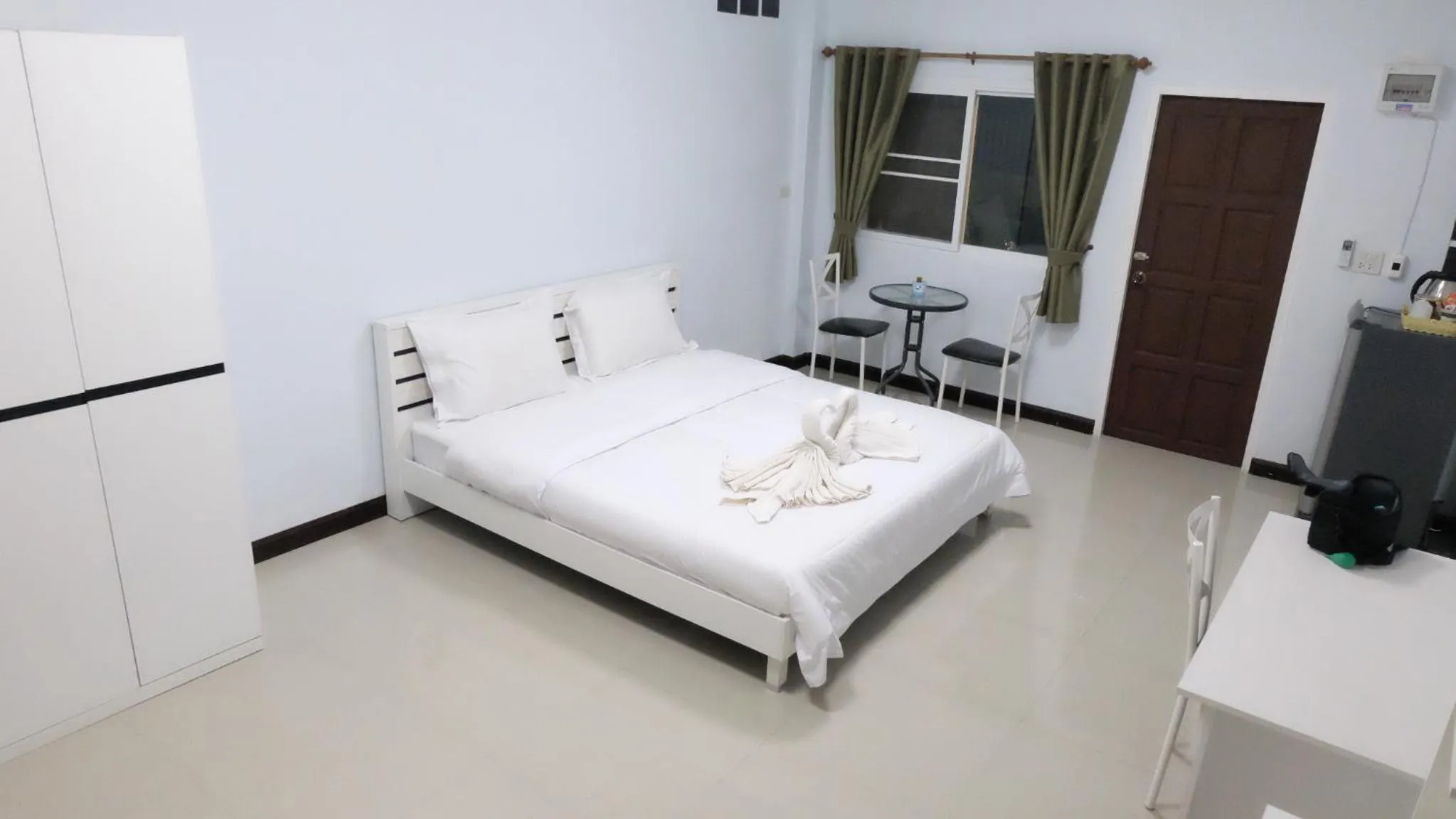 Bed in Ruen Aiyara Apartment