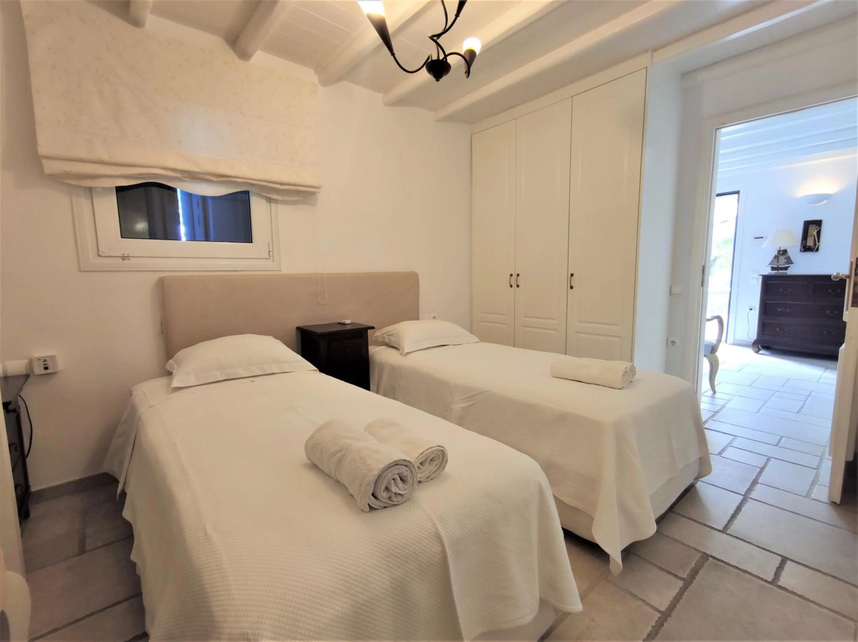 Bed in Mykonian Iros Suites & Villas