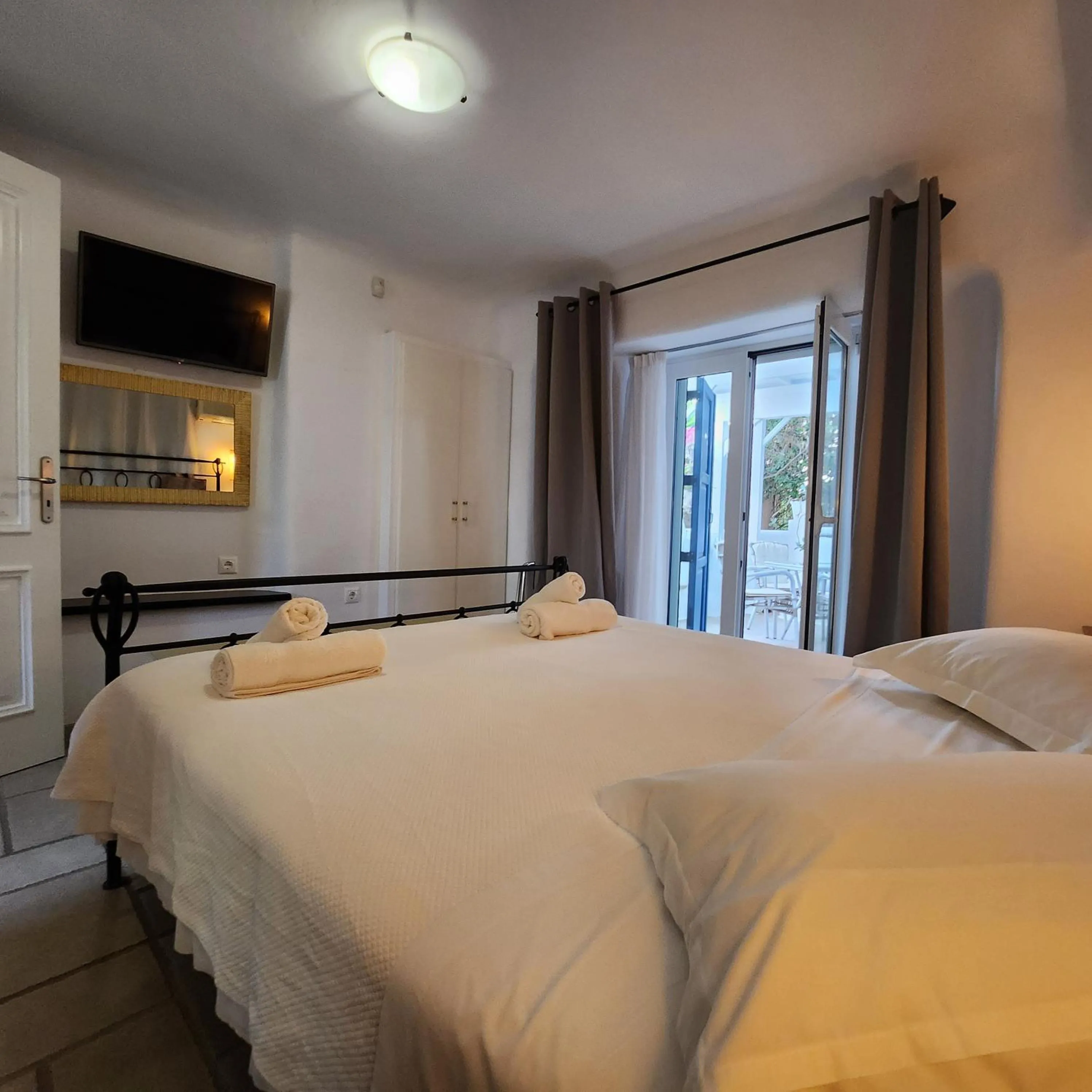 Bed in Mykonian Iros Suites & Villas