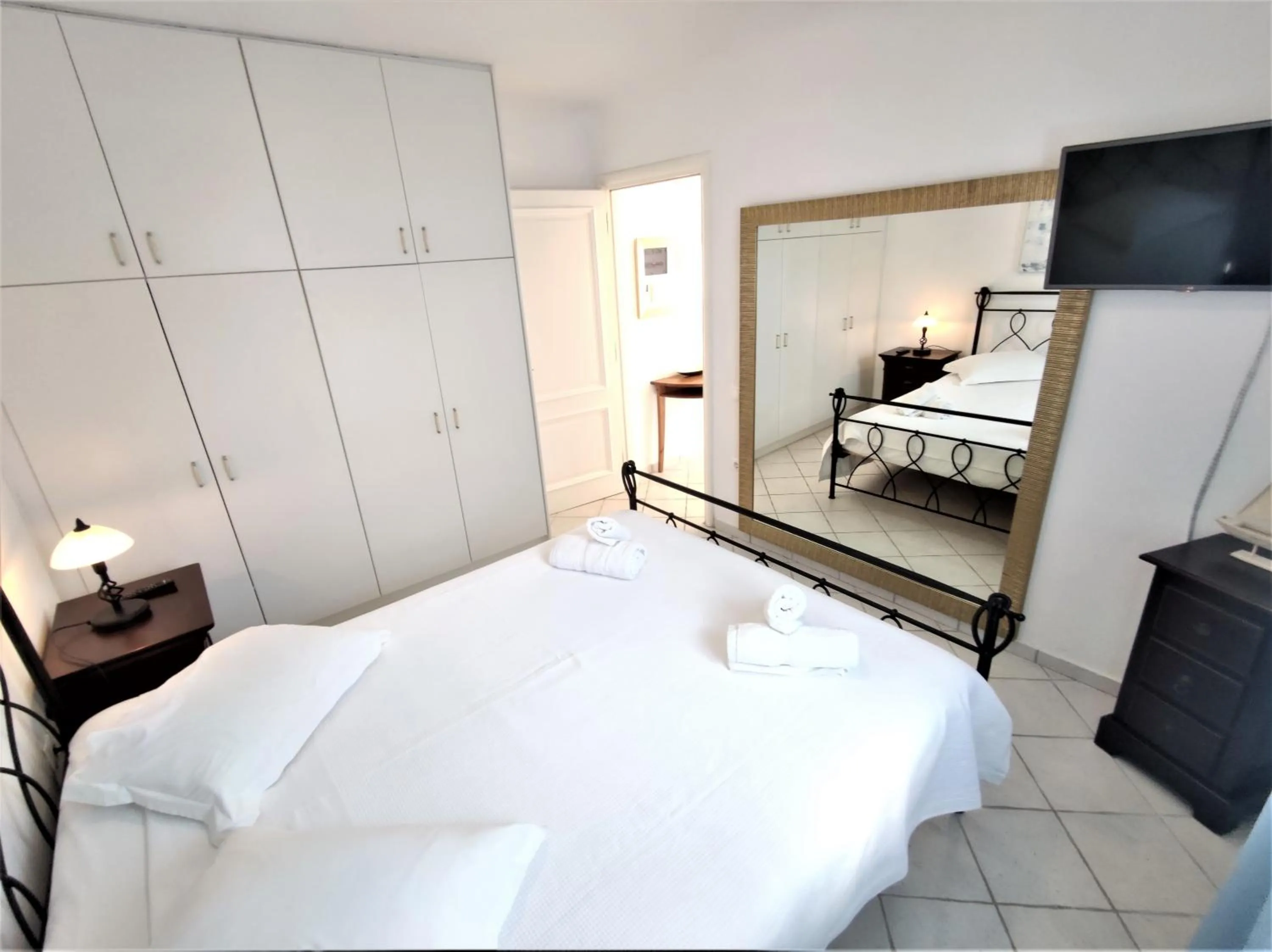 Bed in Mykonian Iros Suites & Villas