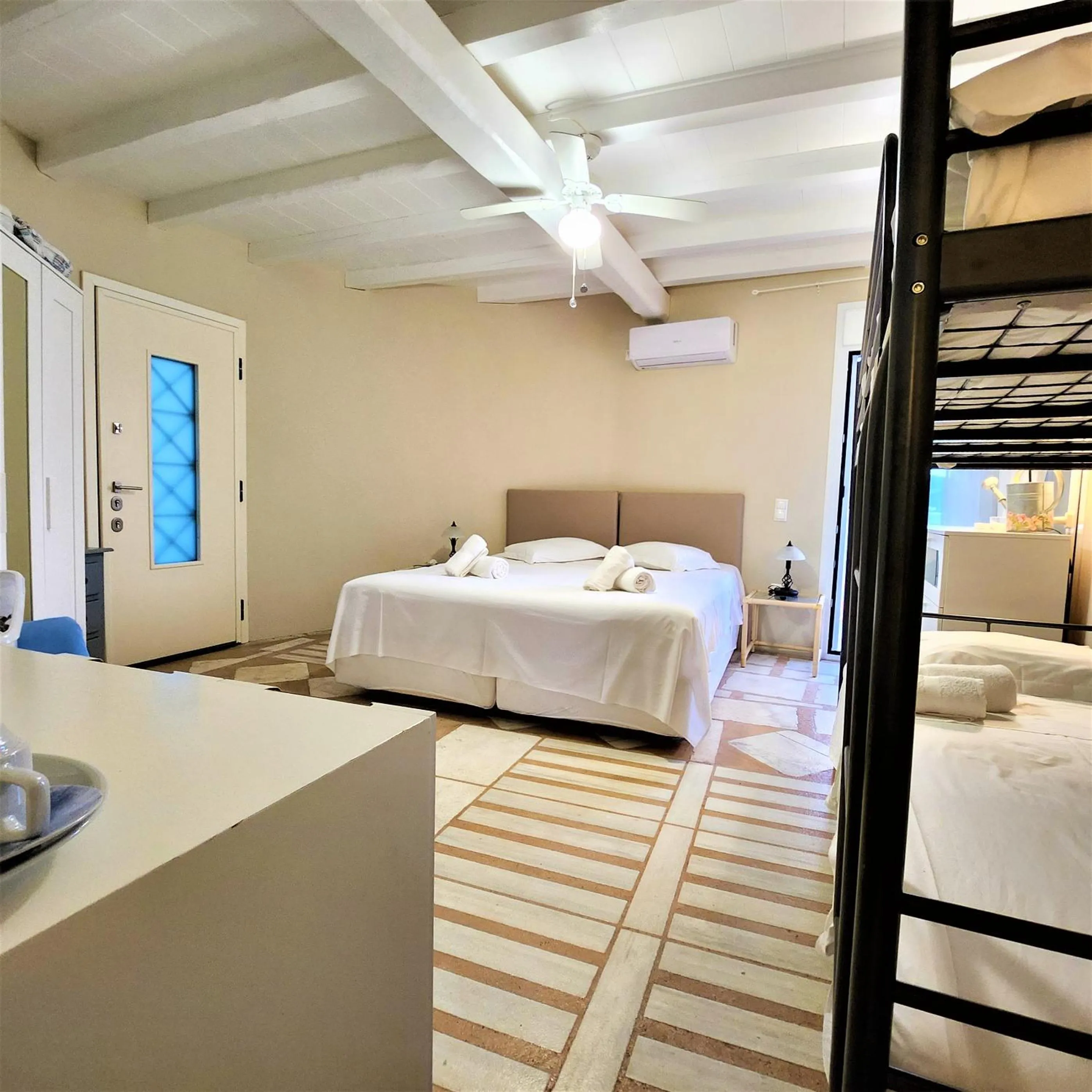 Bed in Mykonian Iros Suites & Villas