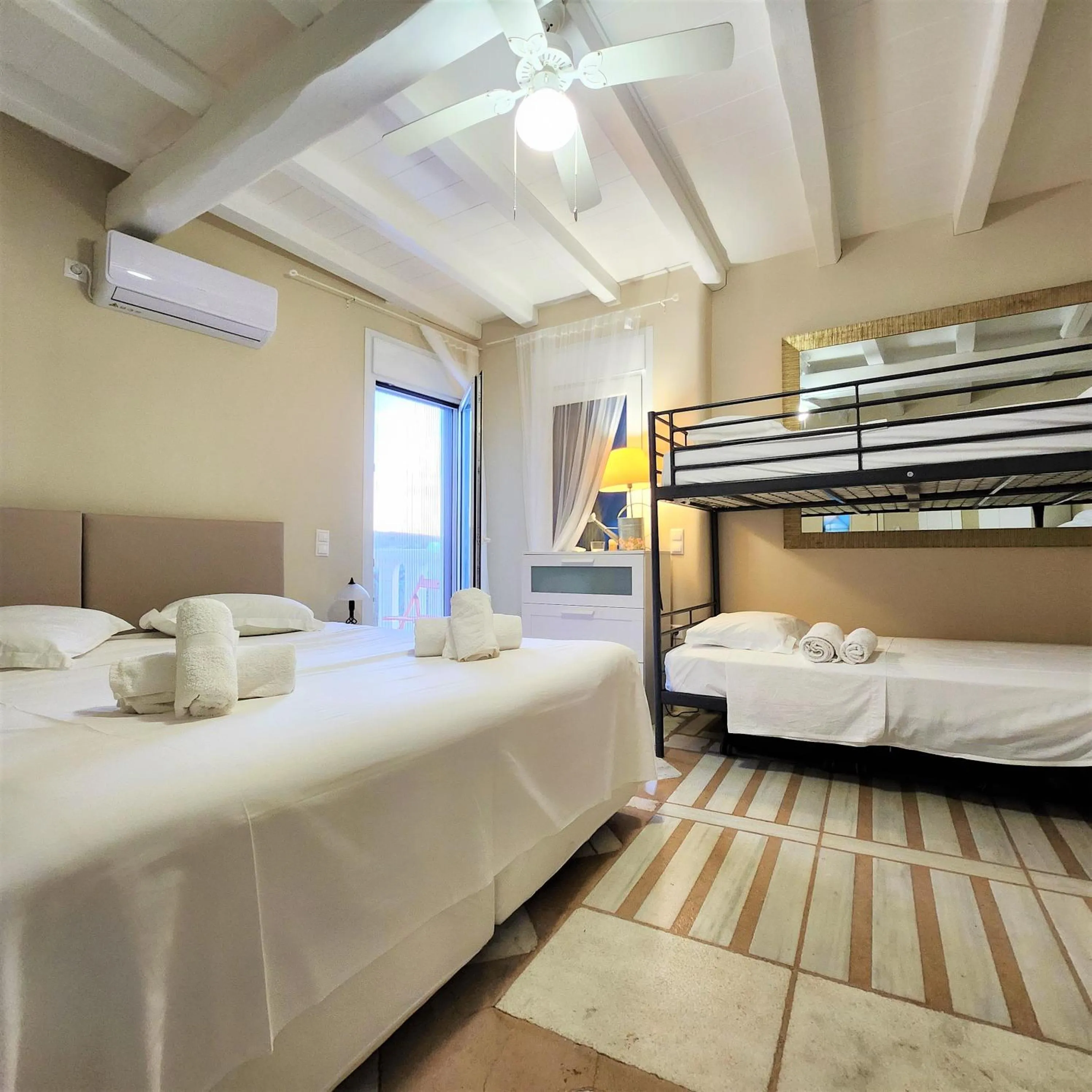 Bed in Mykonian Iros Suites & Villas