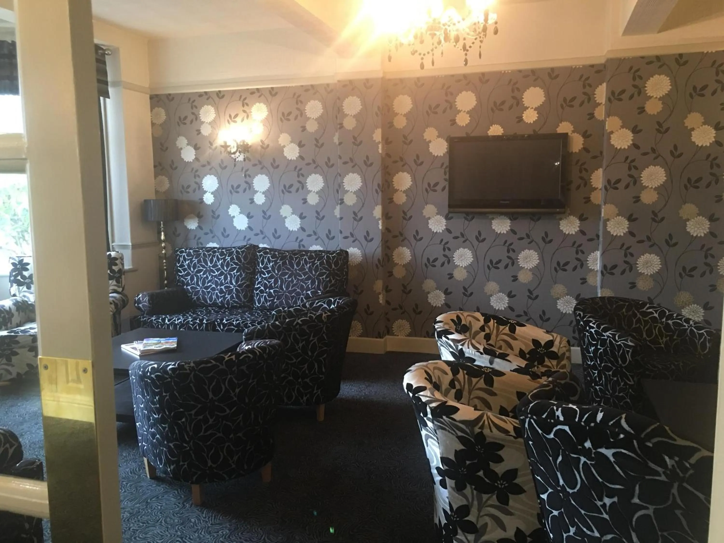 Communal lounge/ TV room in The Savoy