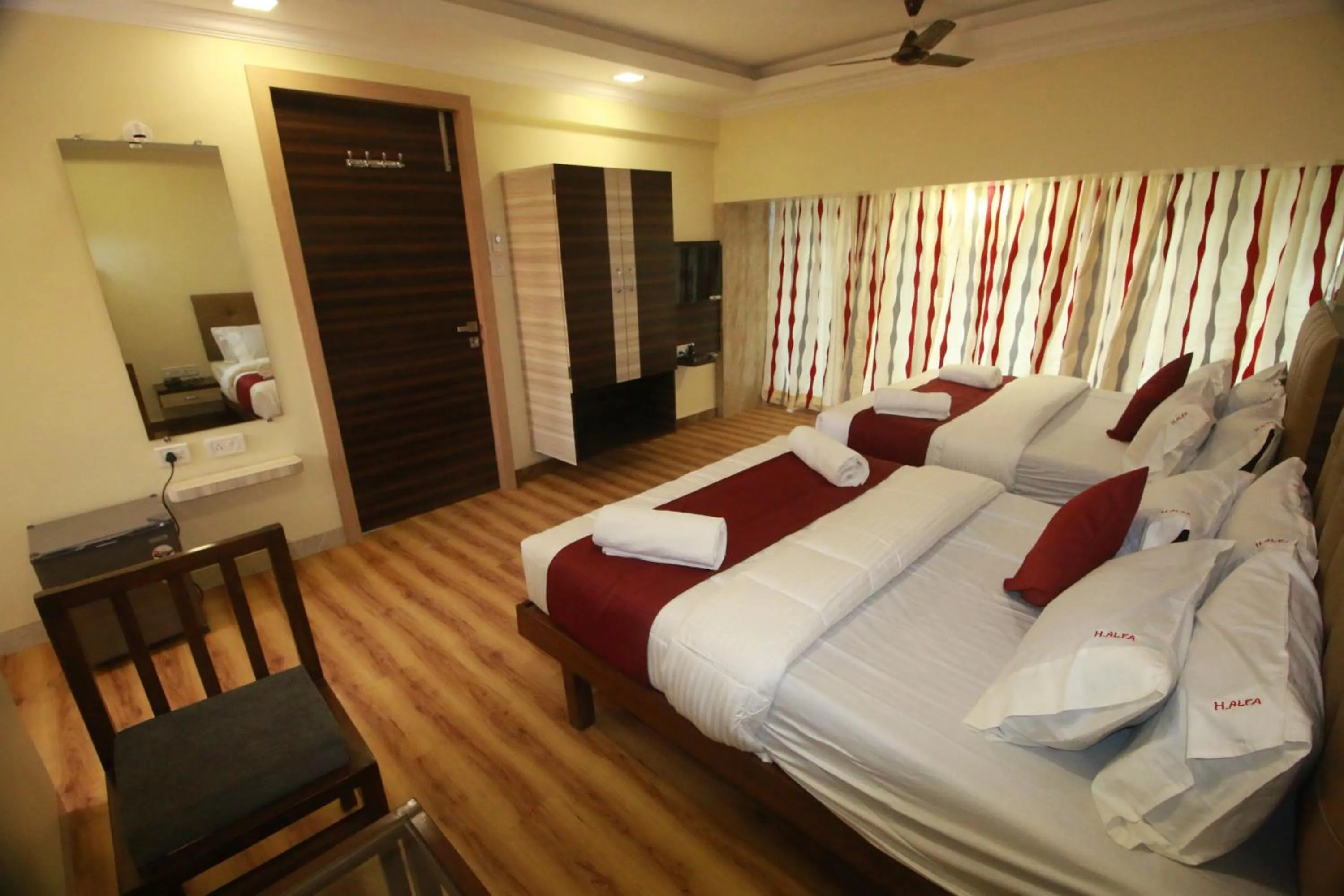 TV and multimedia, Bed in Hotel Alfa International Near Nanavati Hospital Mumbai Near Airport Mumbai Near Juhu Beach