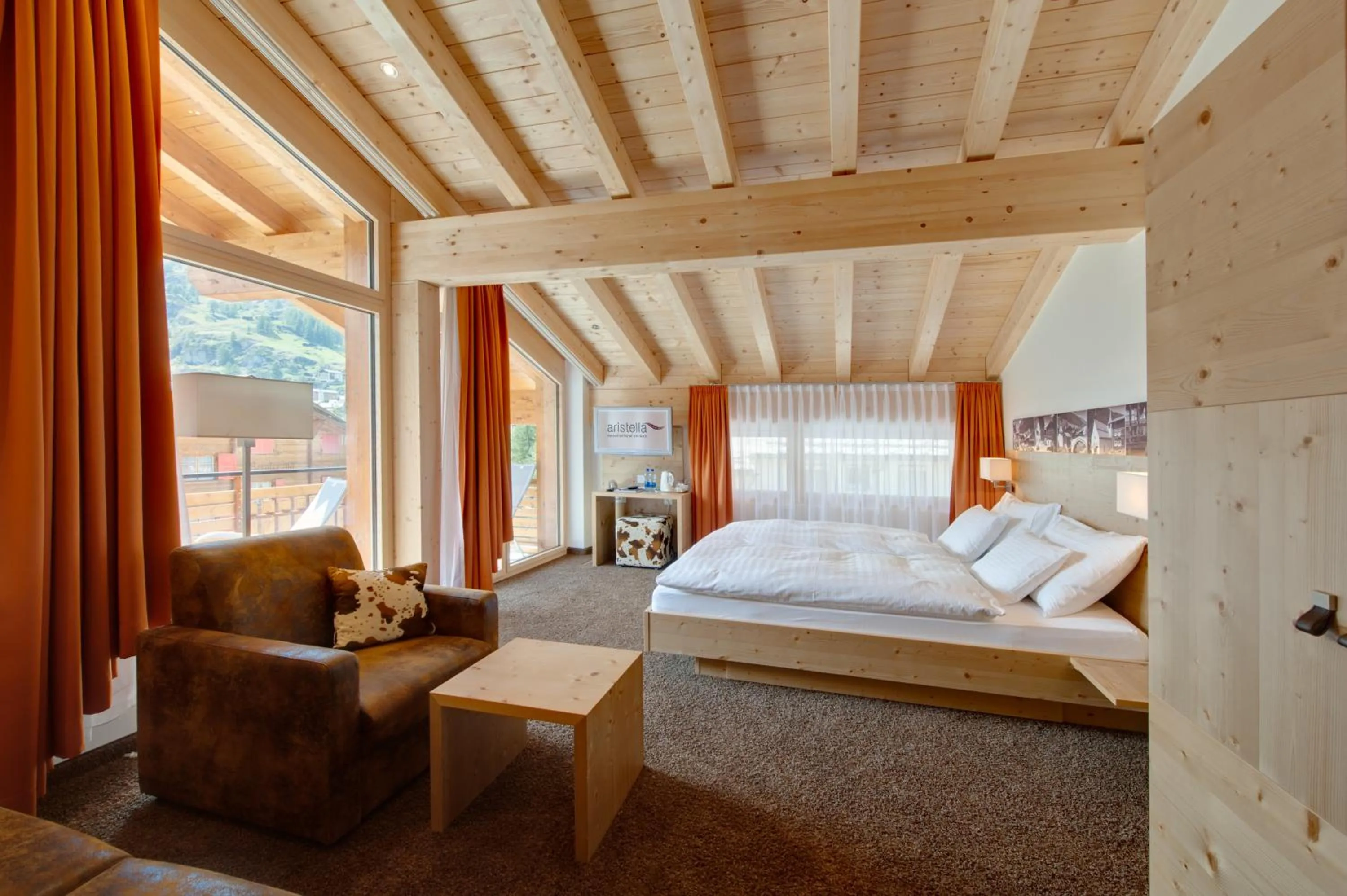 Bed in Hotel Aristella Swissflair