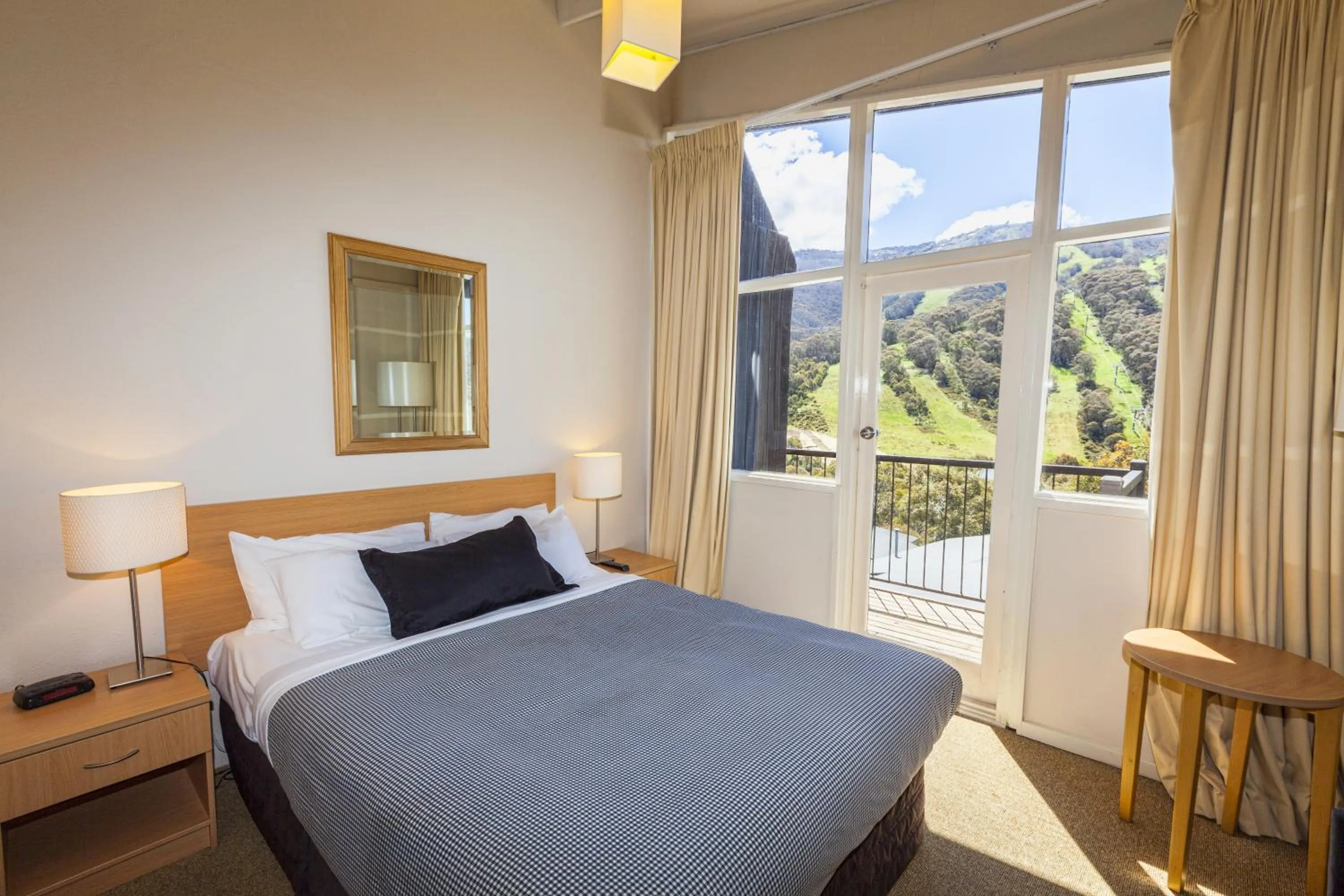 Bed in The Denman Hotel in Thredbo