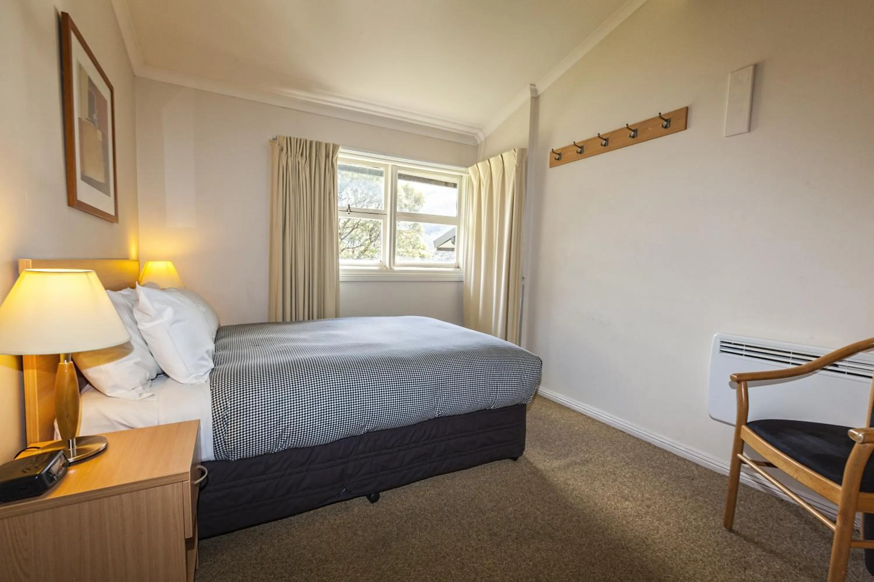 Bed in The Denman Hotel in Thredbo