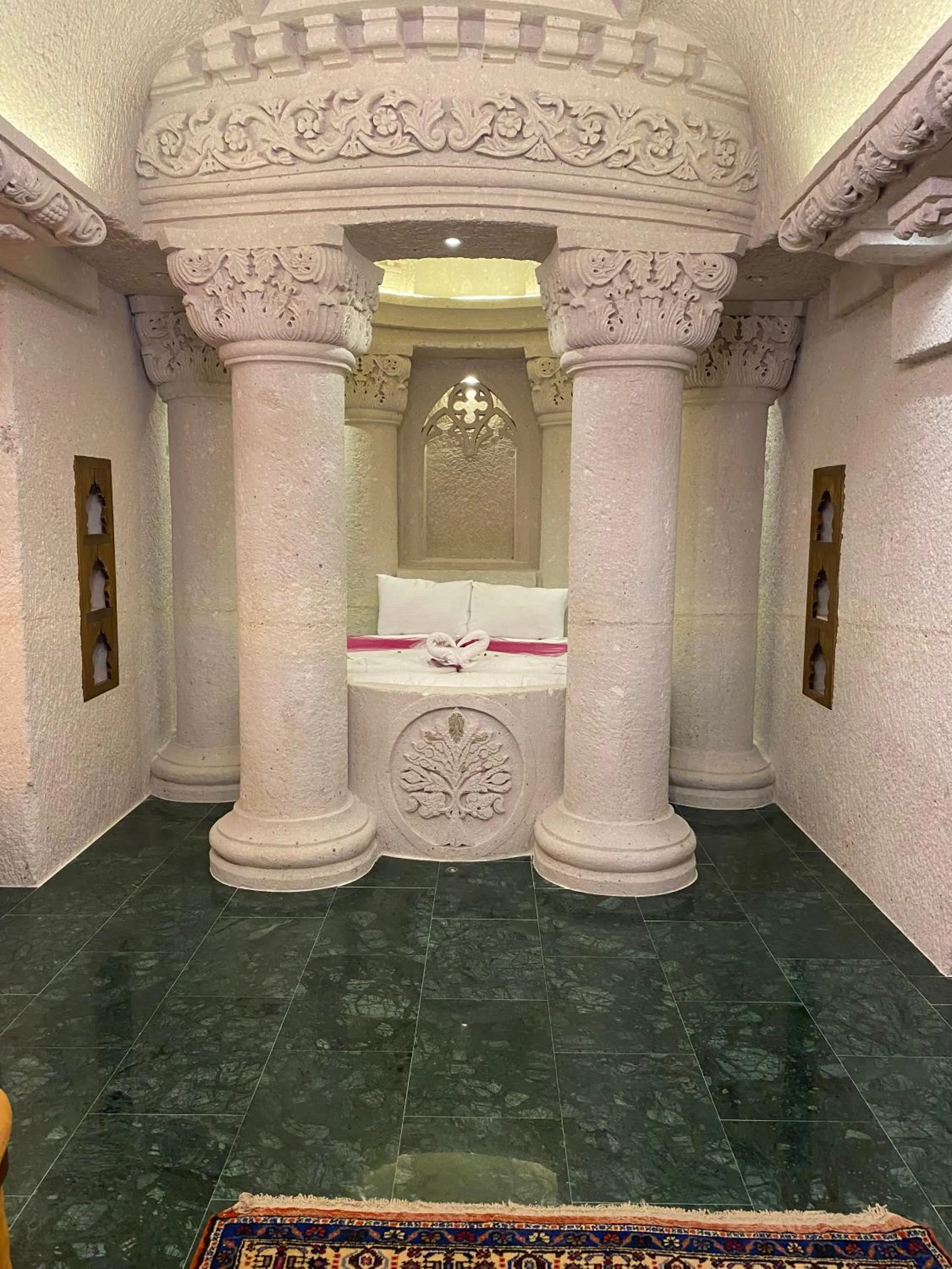 Bed in Abu Hayat Cave Suites