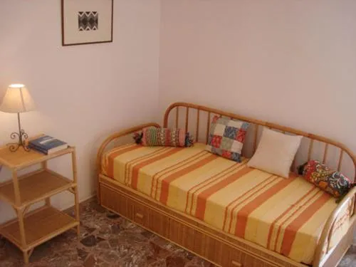 Seating area, Bed in Case Vacanze Arcobaleno