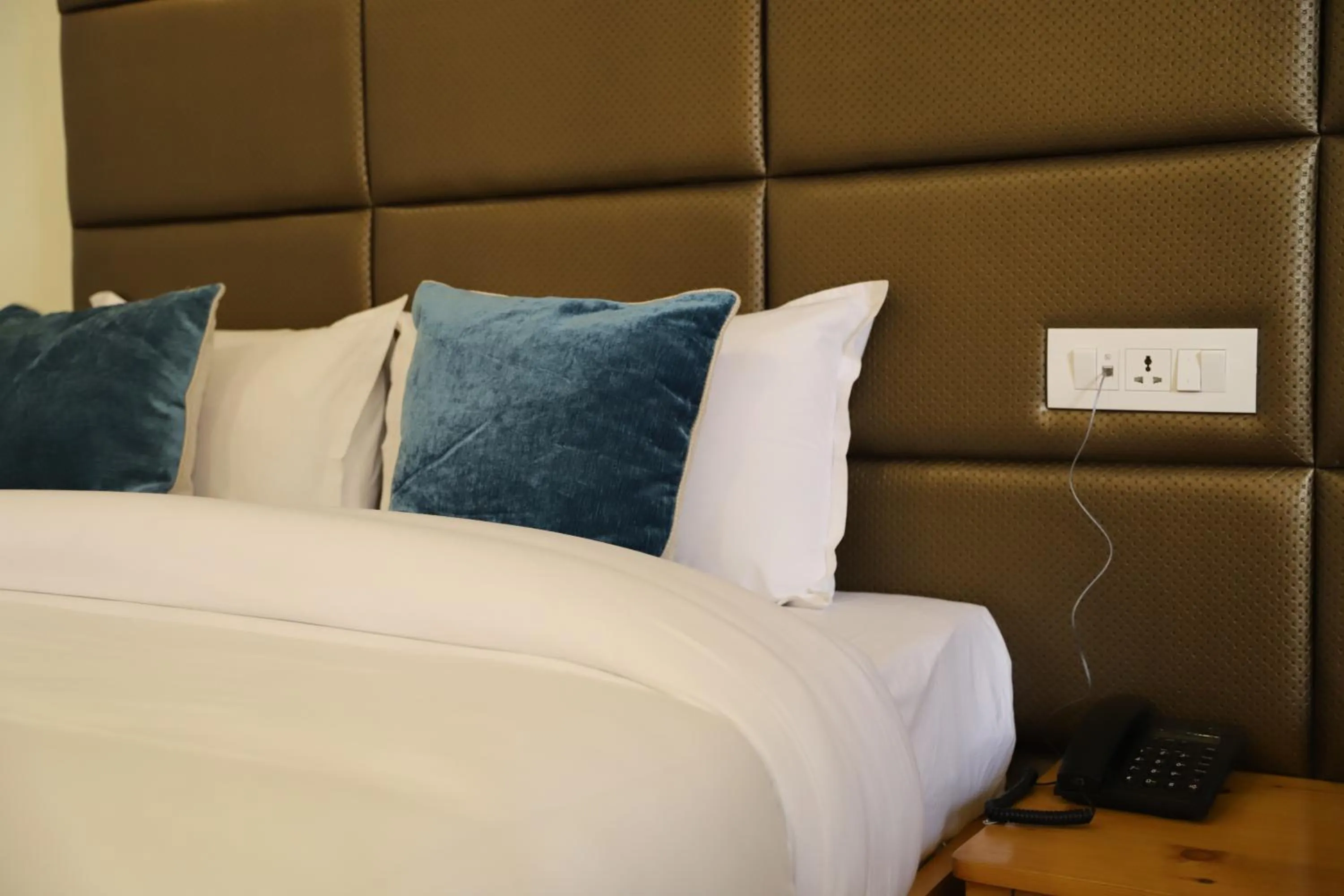 Bed in Nepal Cottage Resort