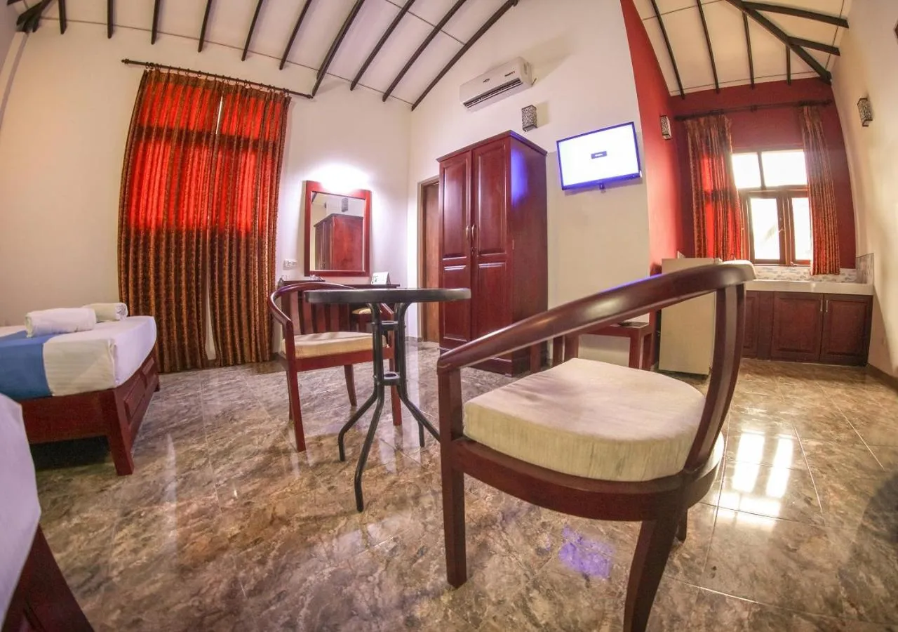 Toilet, Bed in White Rose Beach Resort