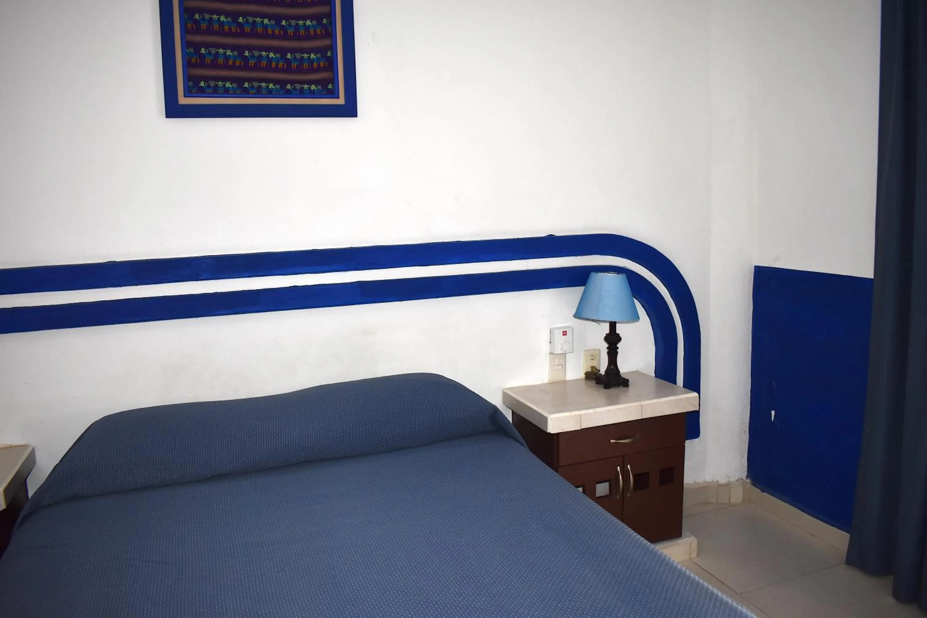 Bed in Plaza Almendros Hotel Isla Mujeres