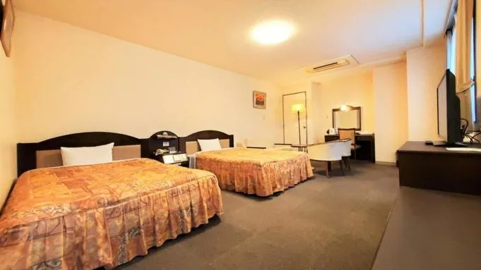 Bed in Nobeoka Urban Hotel