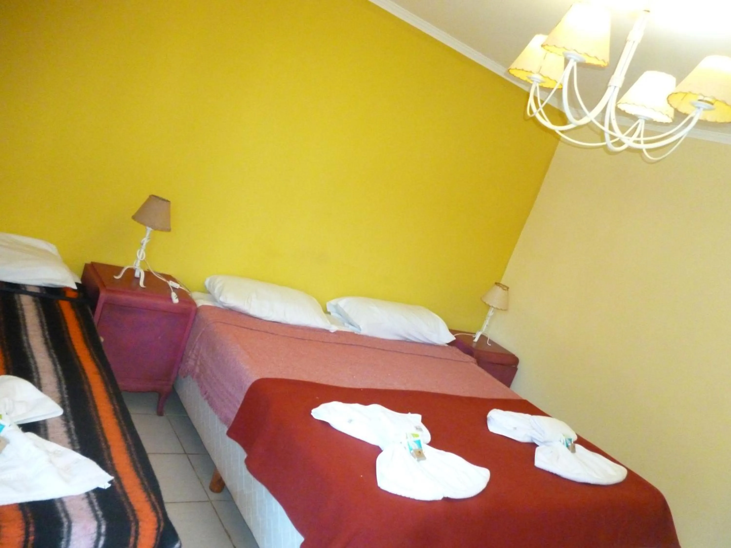 Bed in Passaros Suite Hotel