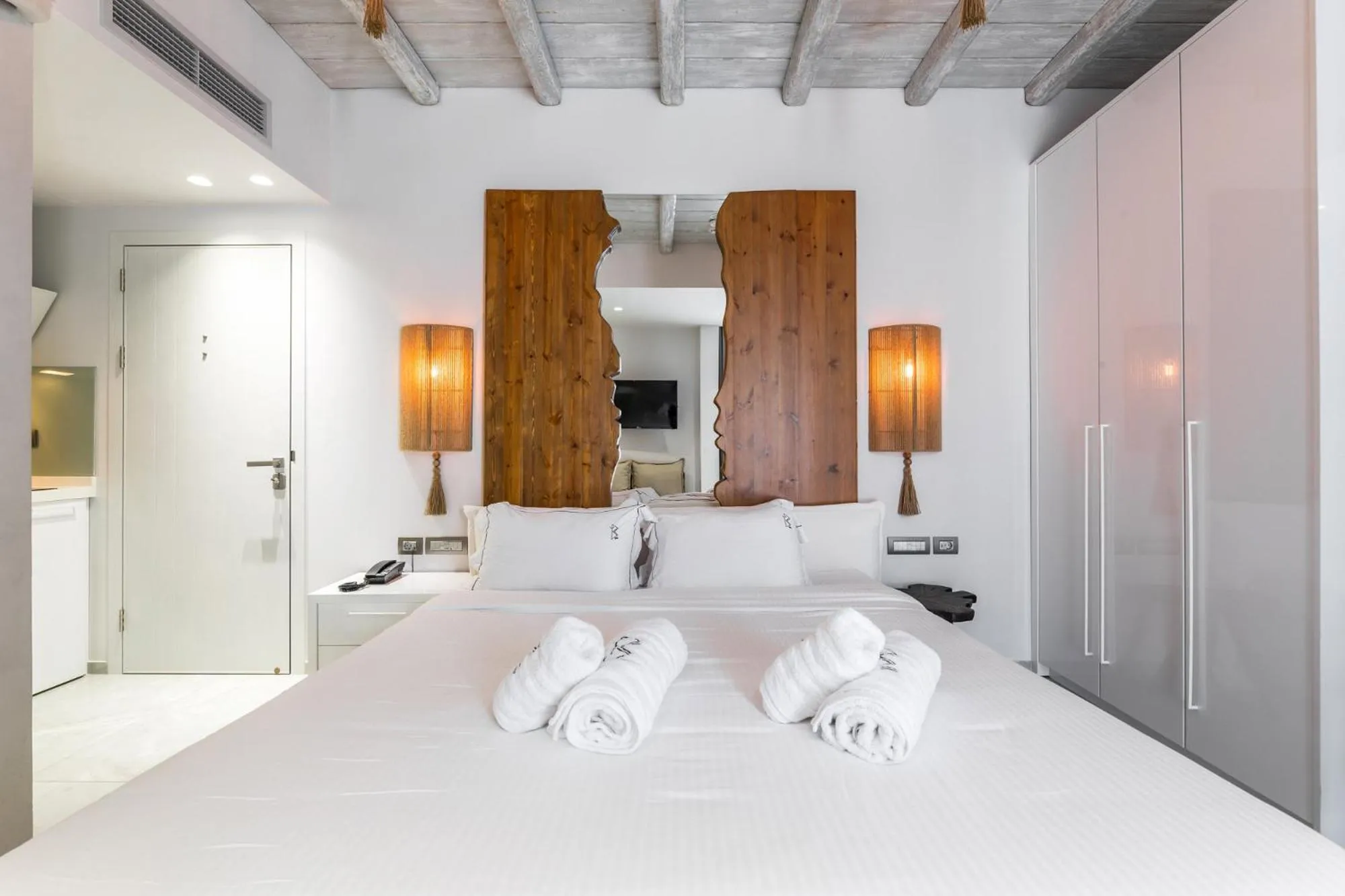 Bed in Blue Carpet Luxury Suites