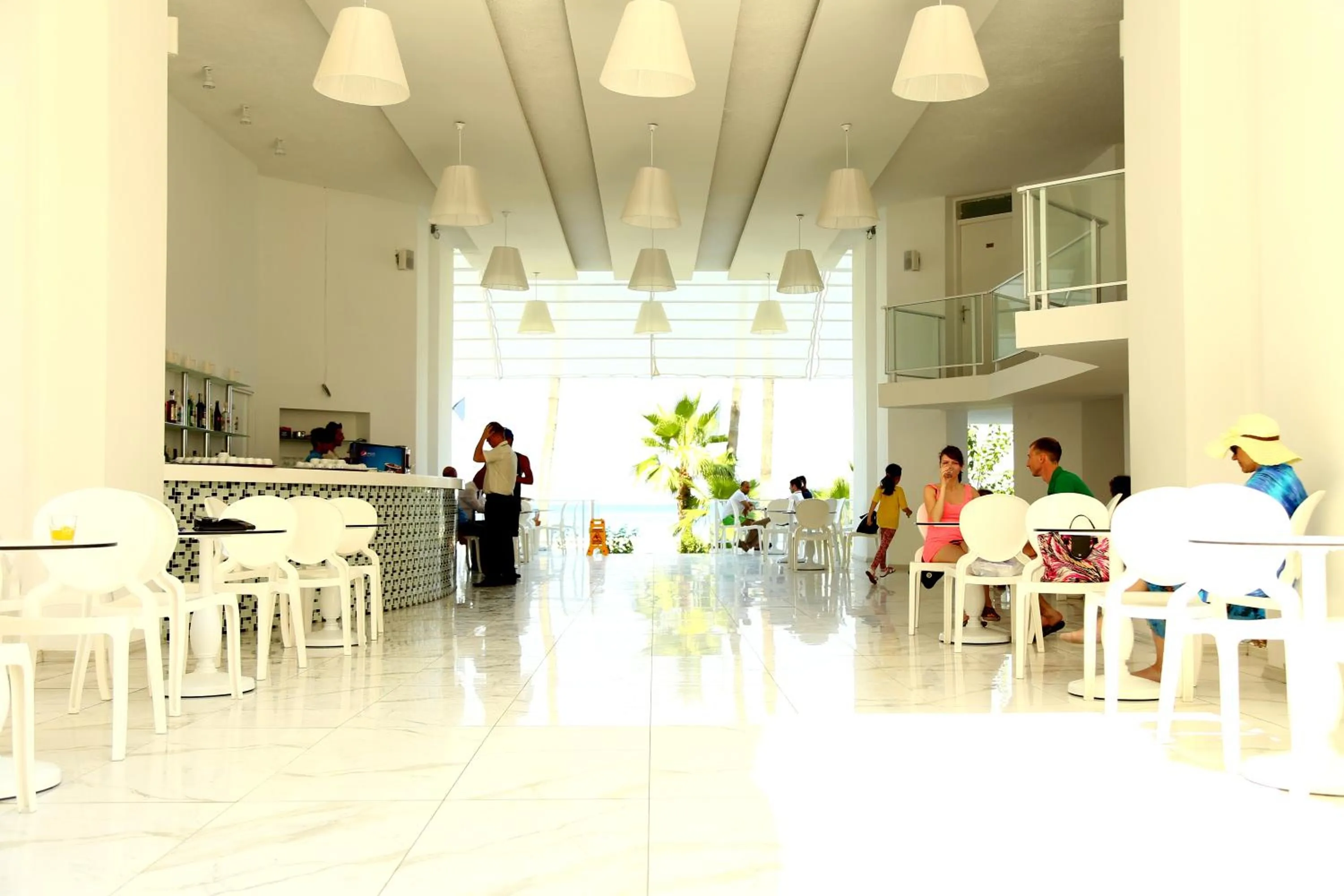 Lounge or bar in Olimpos Beach Hotel by RRH&R