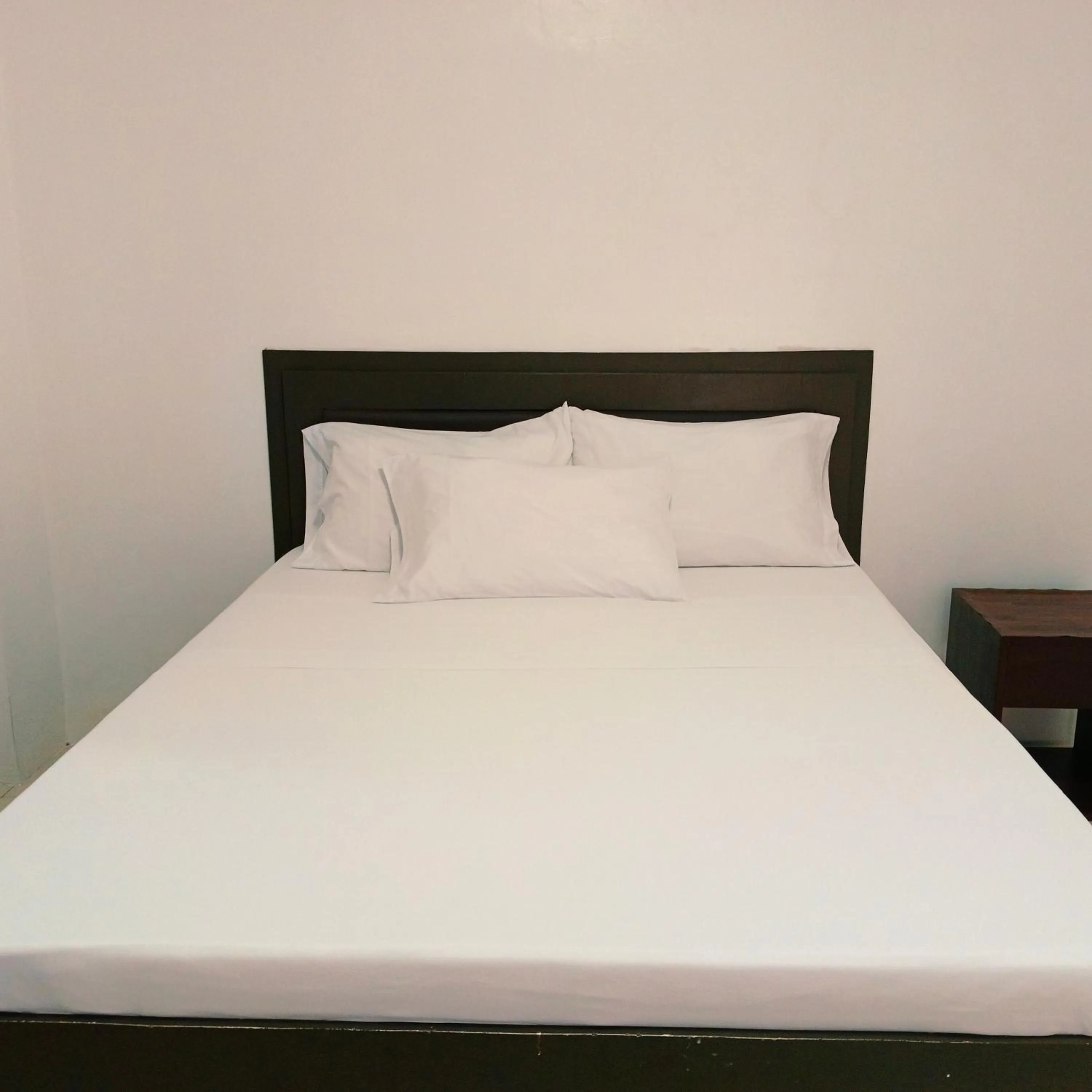 Bed in The Strand Suites and Dormitel