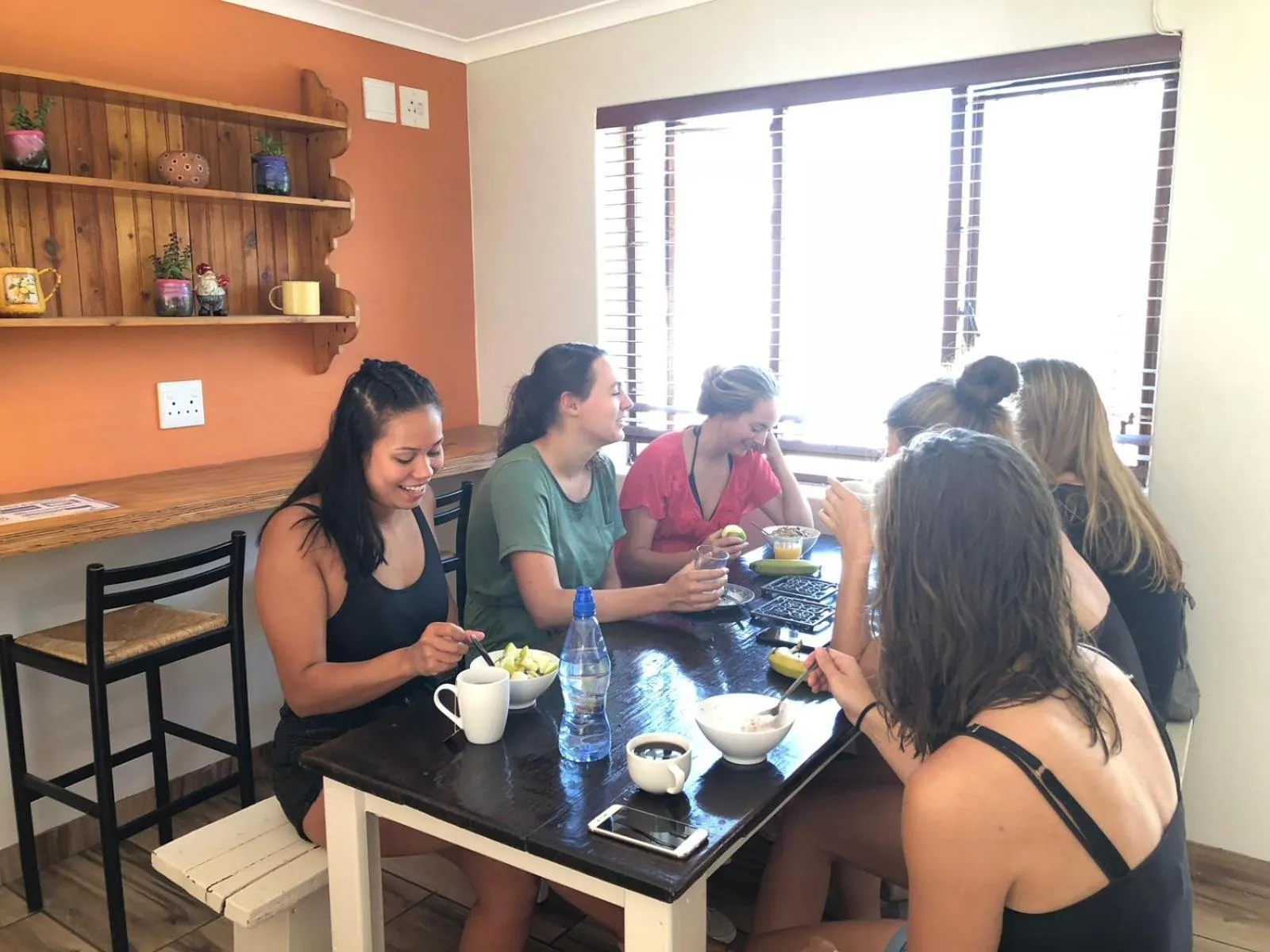 People in A Sunflower Stop Backpackers
