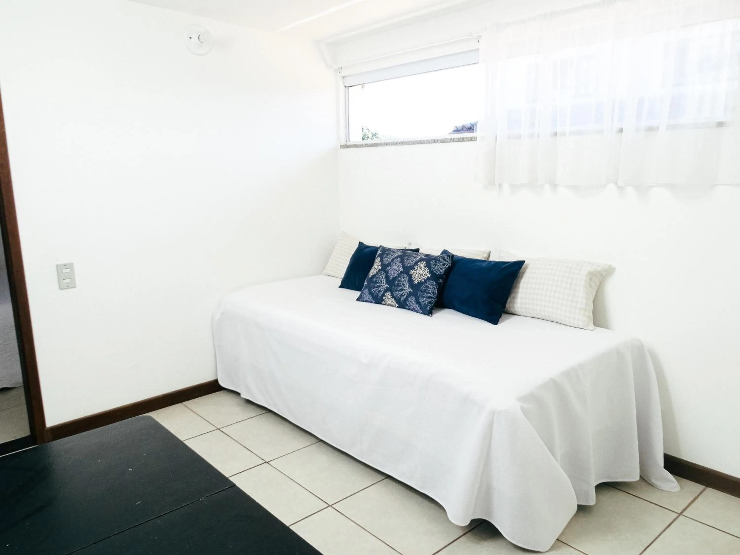 Bed in Viva Búzios Flats