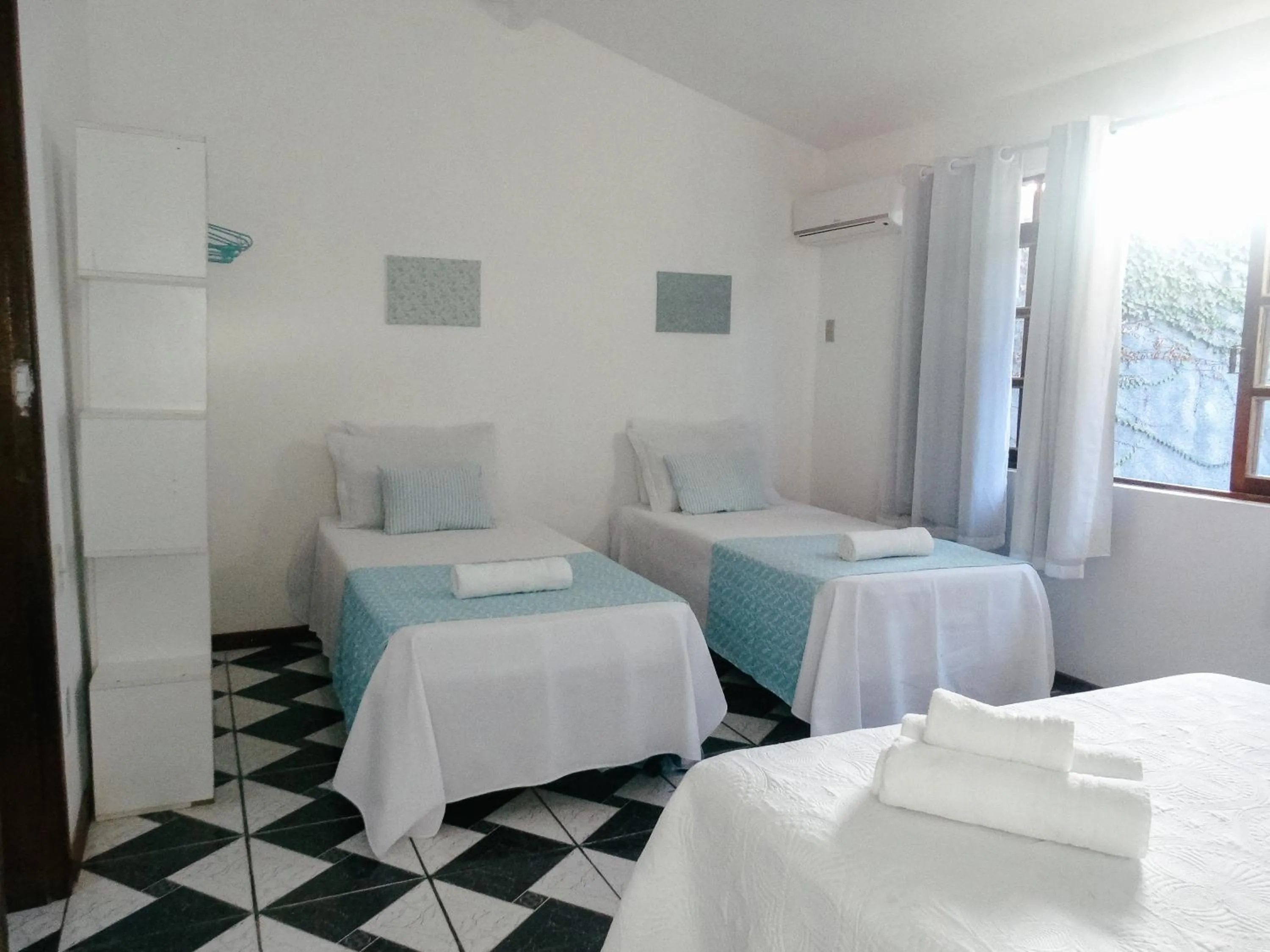 Bed in Viva Búzios Flats