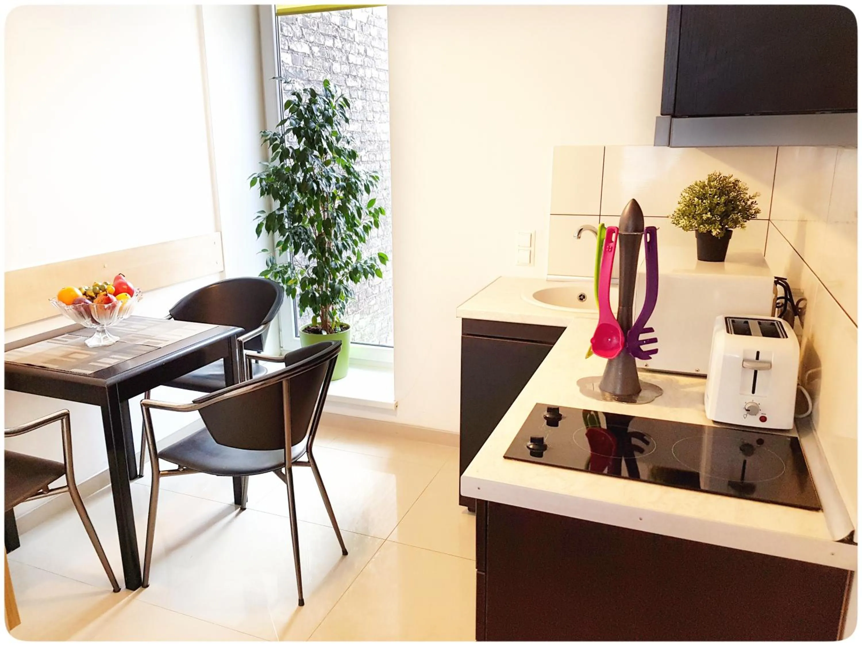 Kitchen or kitchenette in HOME Apart-Hotel Vilnius