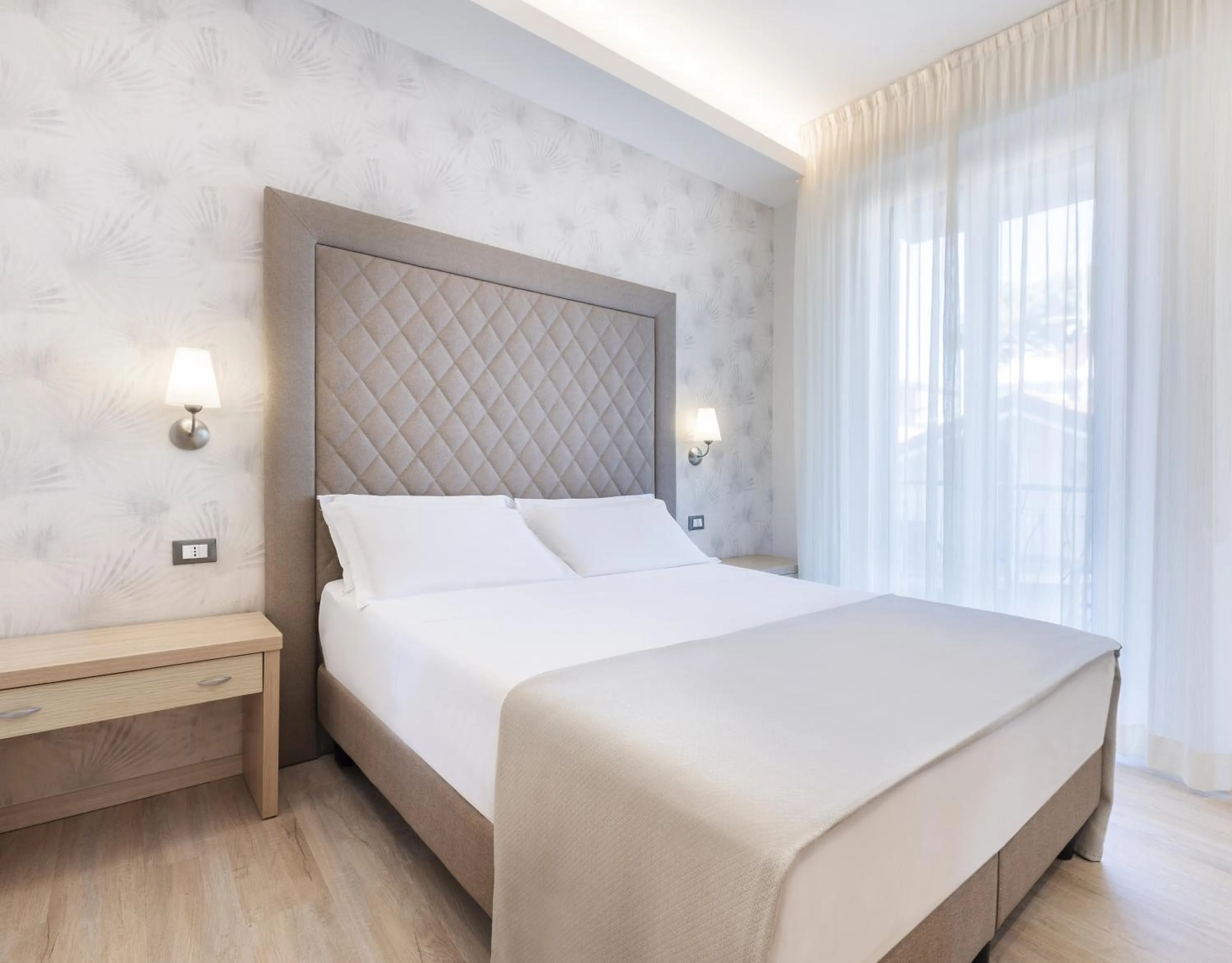 Bed in Hotel Riviera