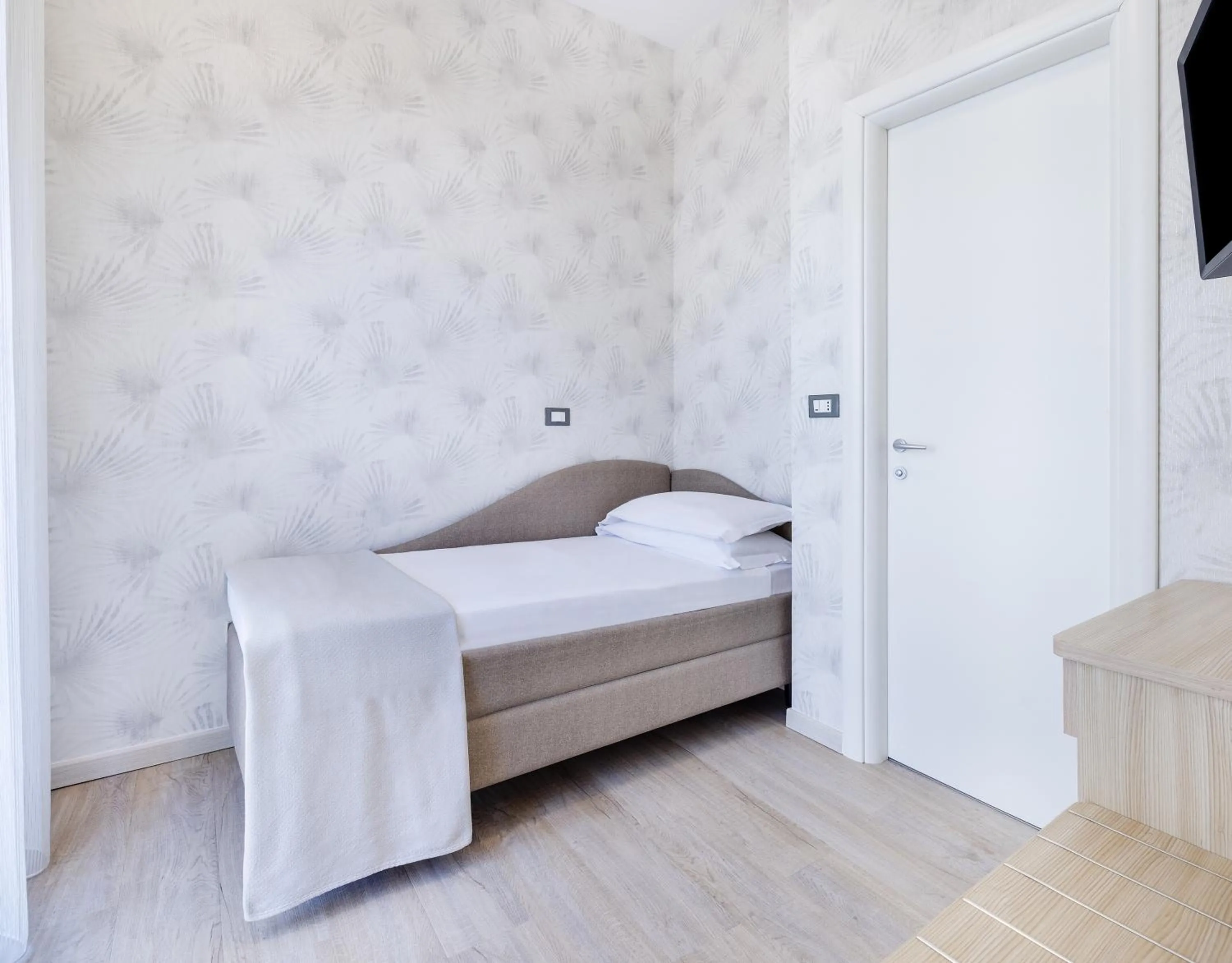 Bed in Hotel Riviera