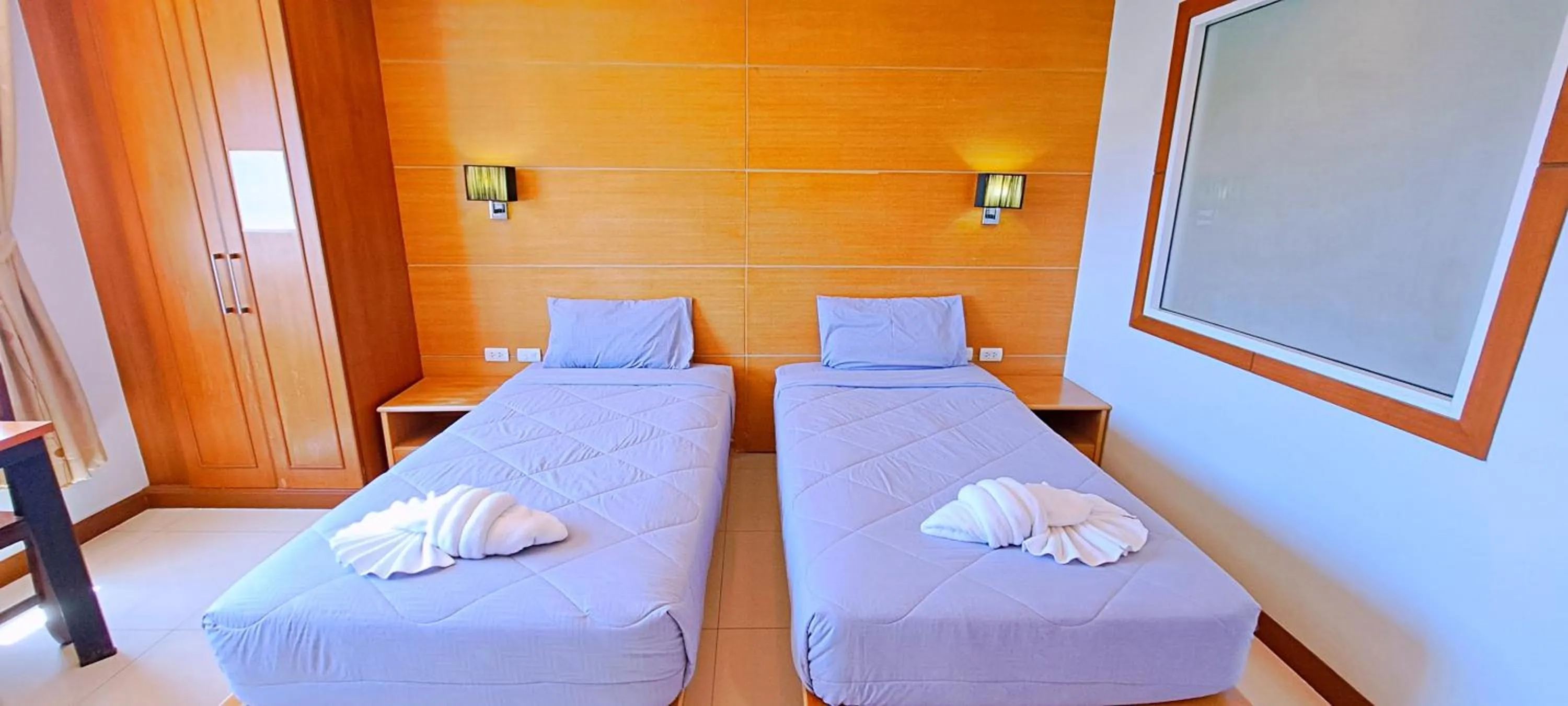 Bed in Green Harbor Hotel & Service Apartment