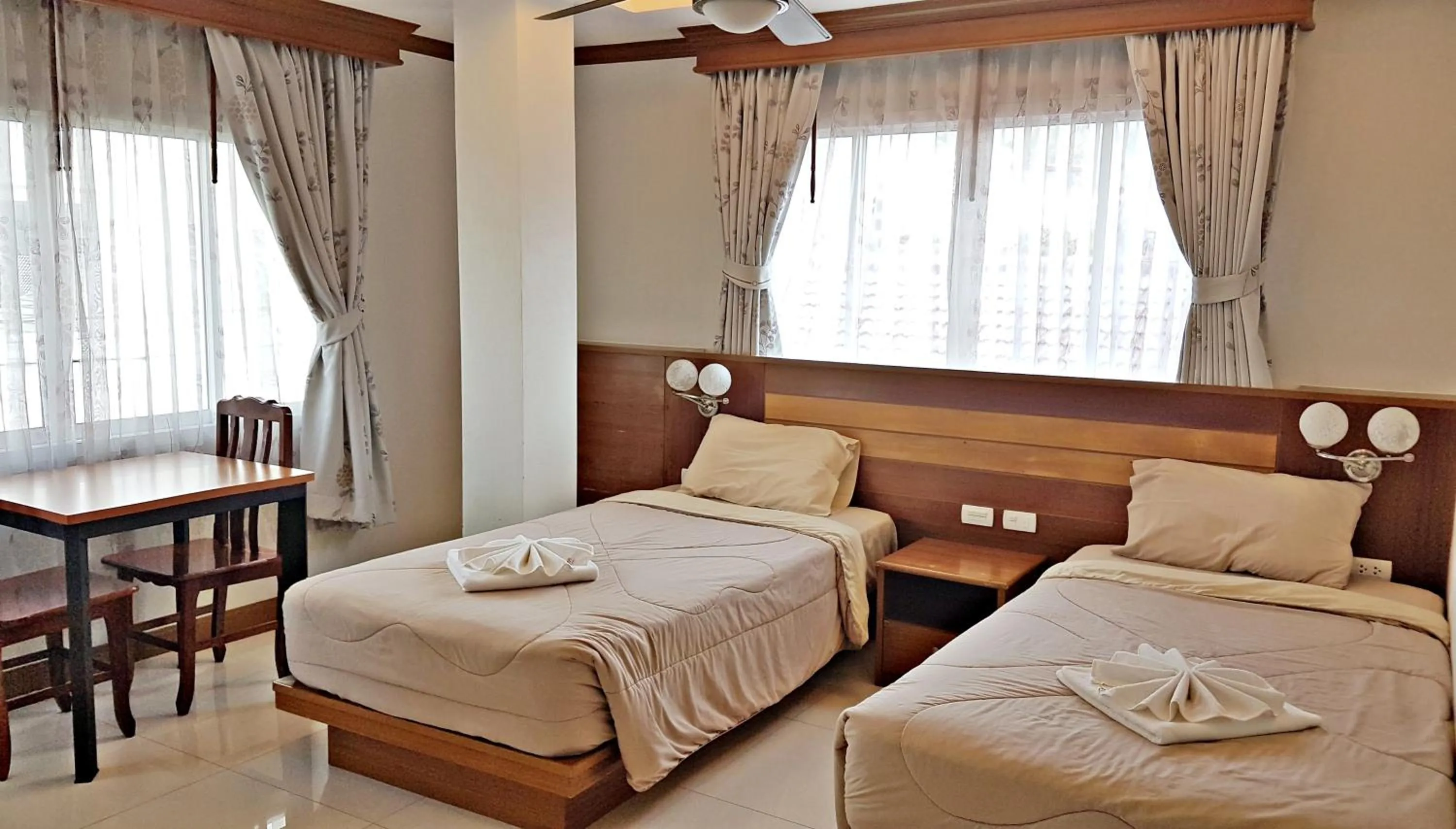 Bed in Green Harbor Hotel & Service Apartment