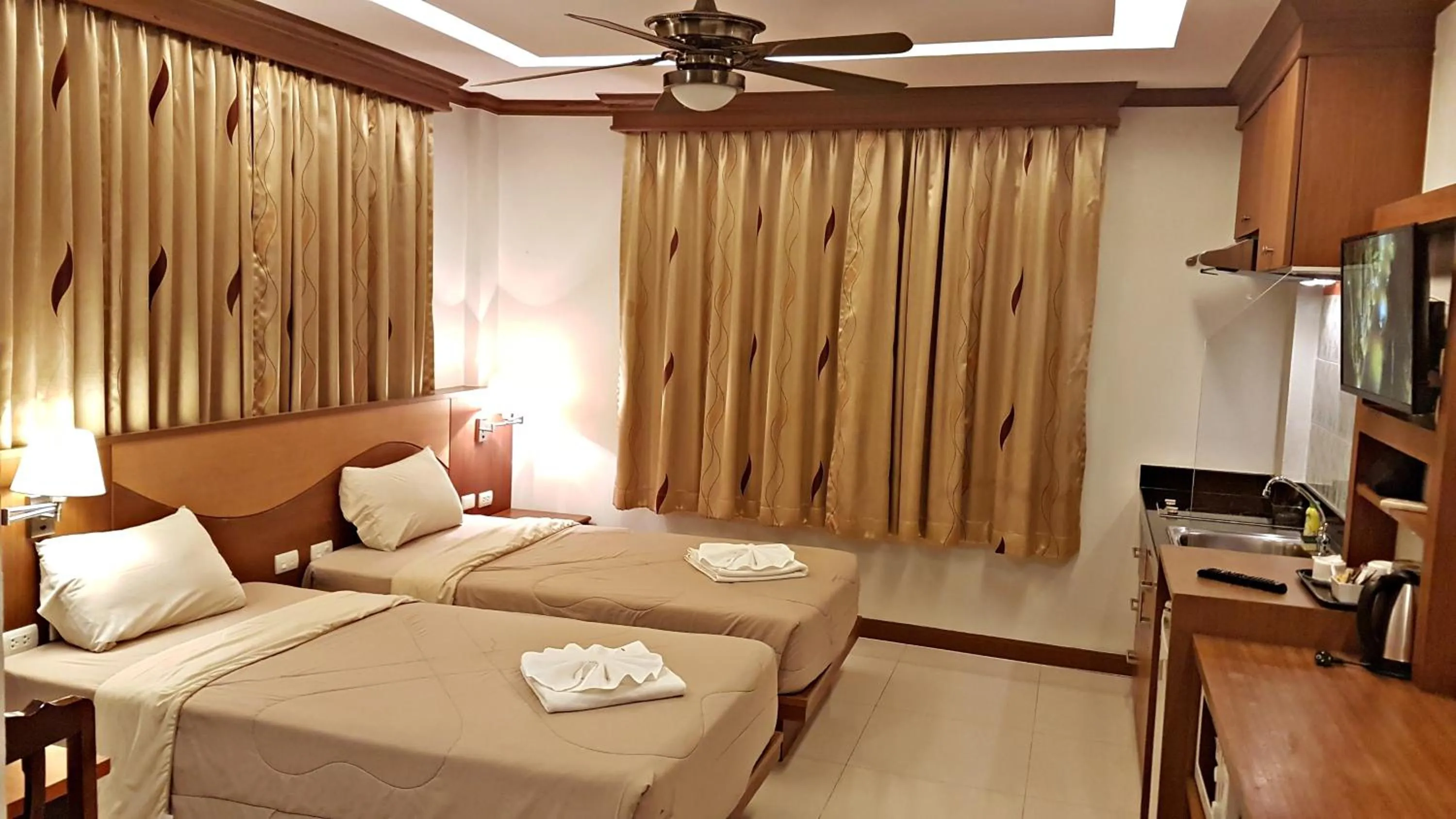 Bed in Green Harbor Hotel & Service Apartment