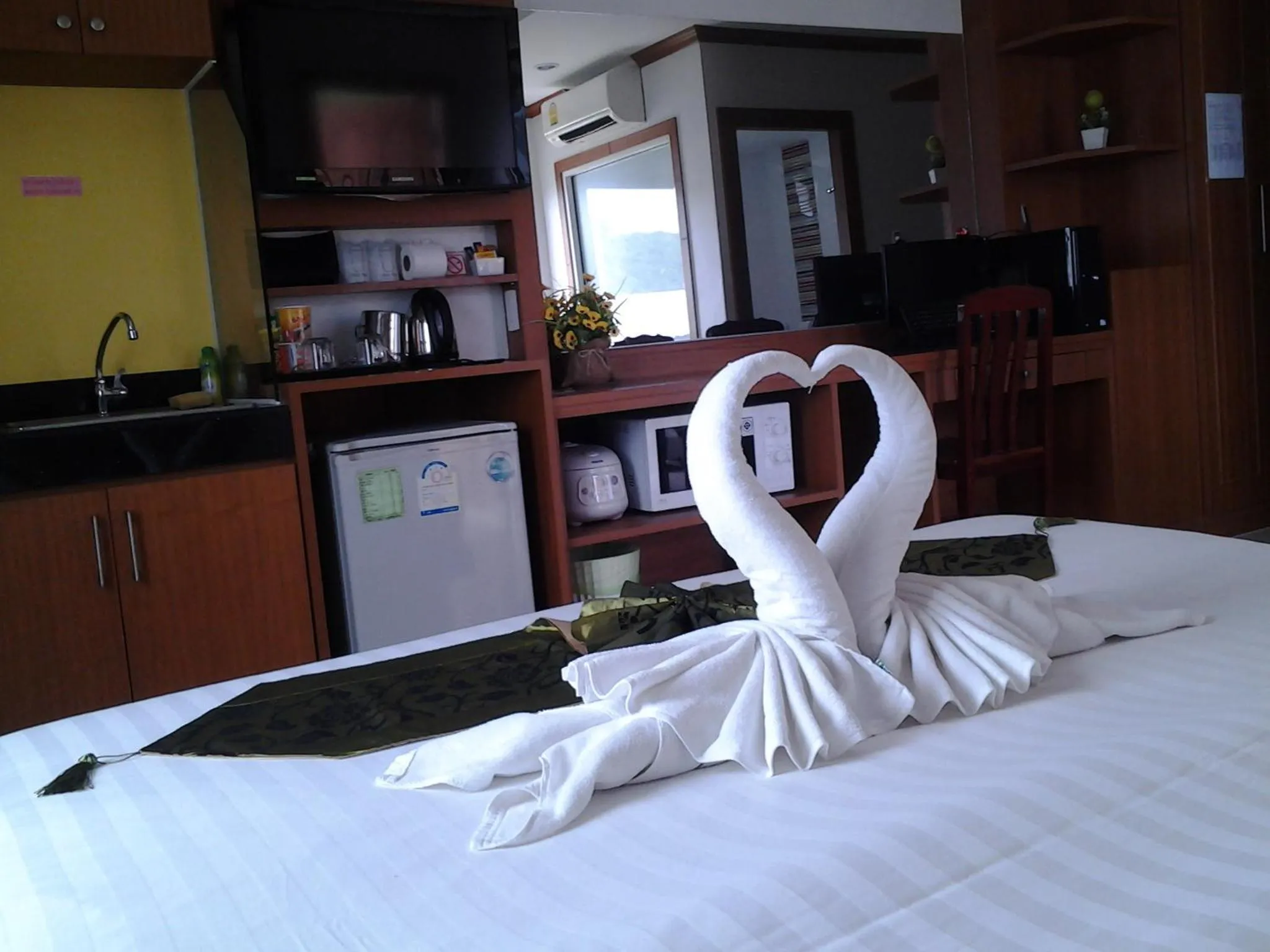 Bedroom, Bed in Green Harbor Hotel & Service Apartment