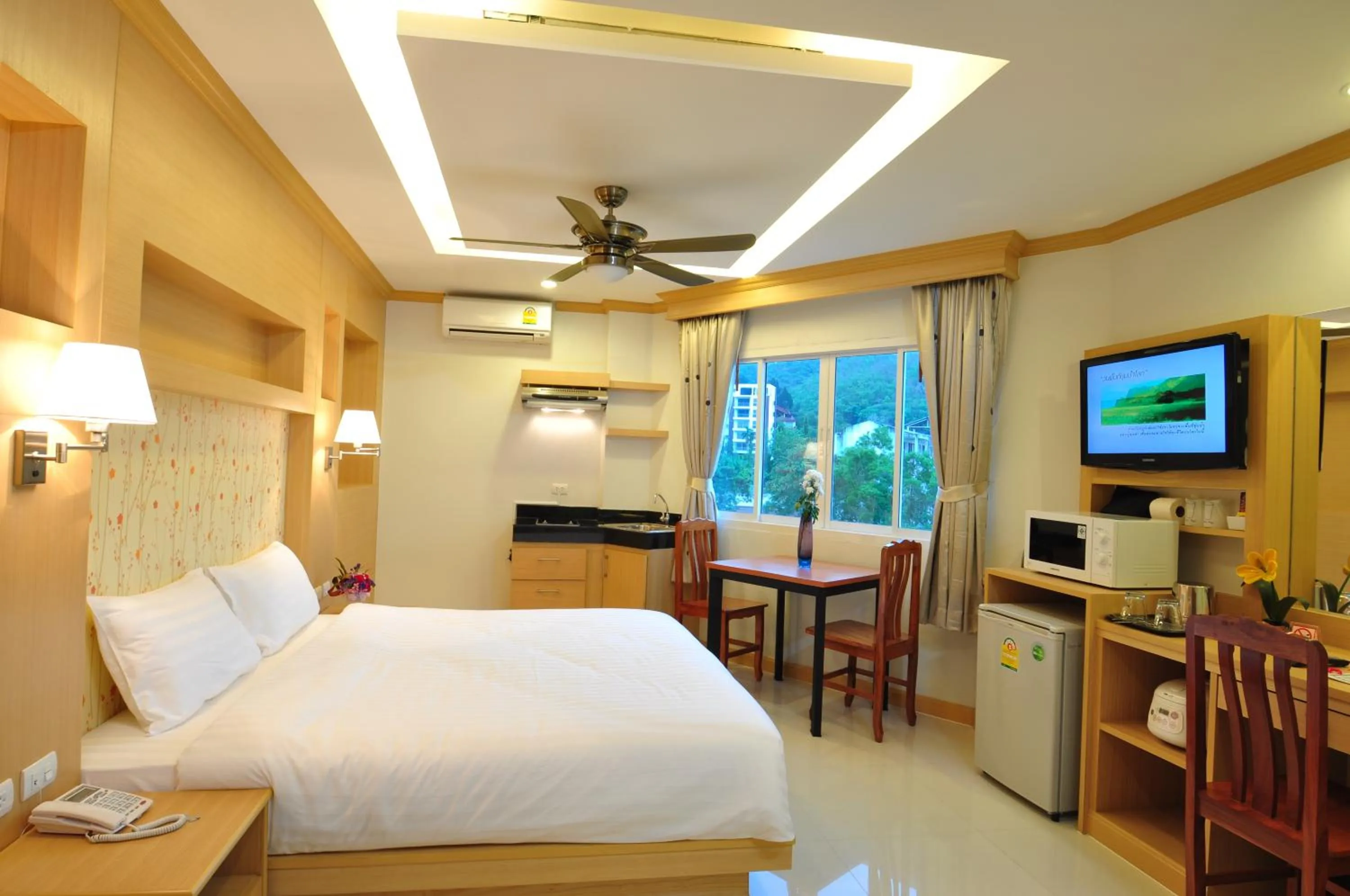 Bedroom, Bed in Green Harbor Hotel & Service Apartment