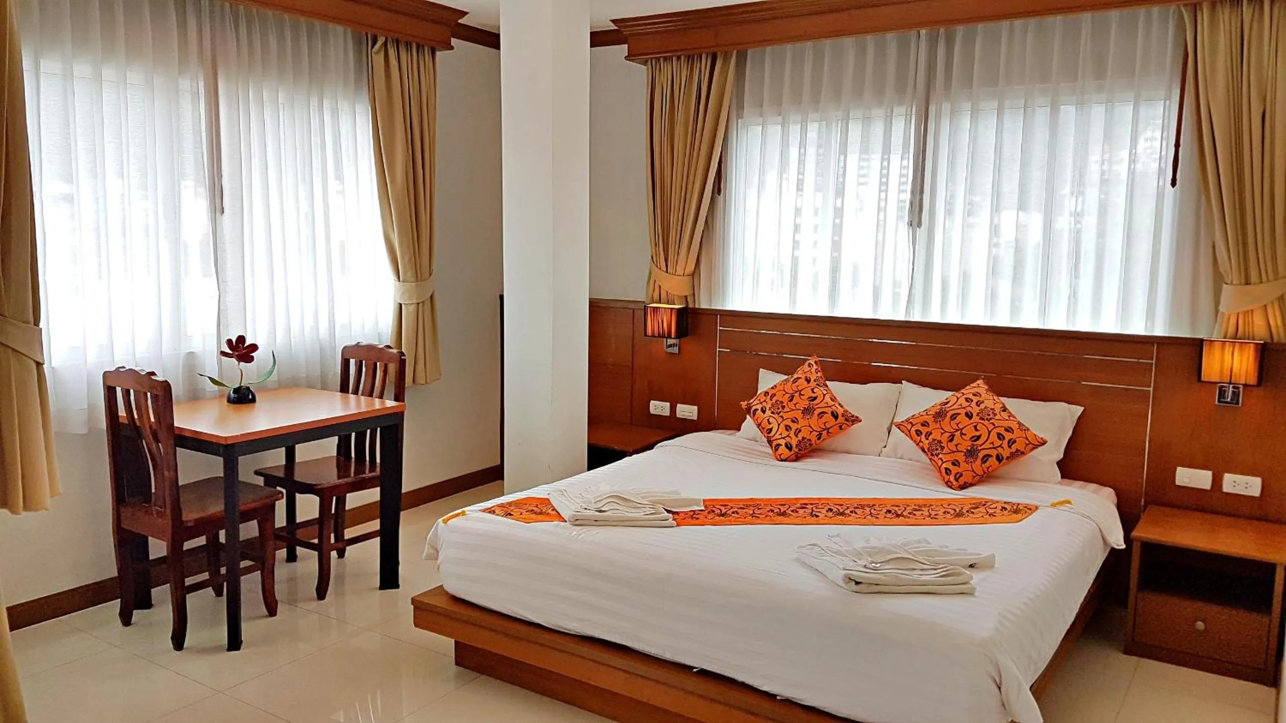 Bed in Green Harbor Hotel & Service Apartment