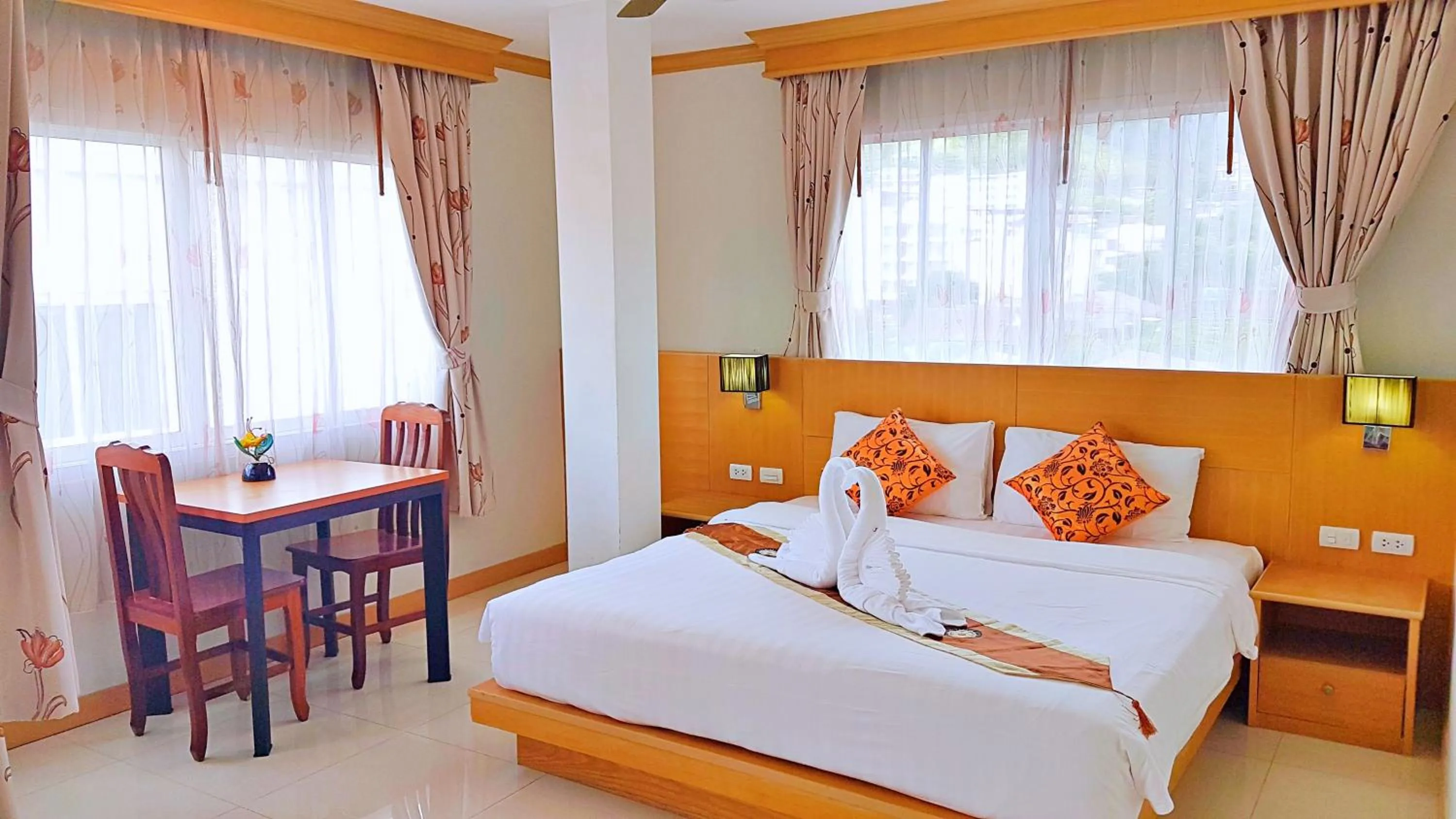 Bed in Green Harbor Hotel & Service Apartment