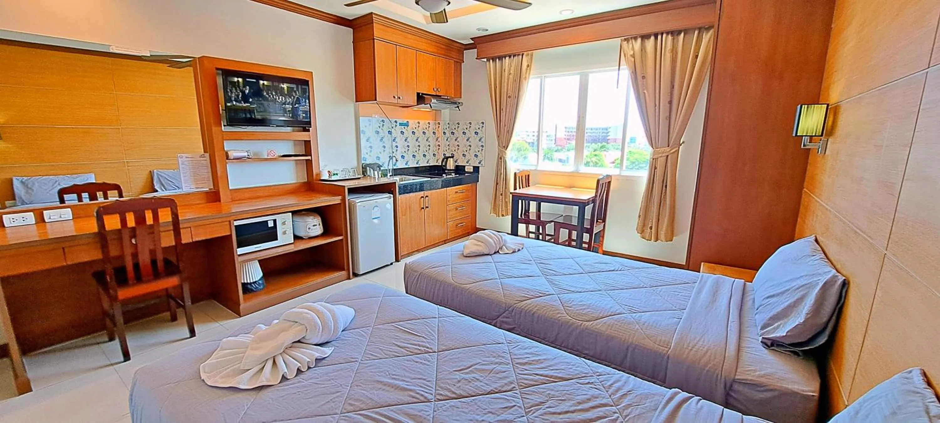 Bed in Green Harbor Hotel & Service Apartment