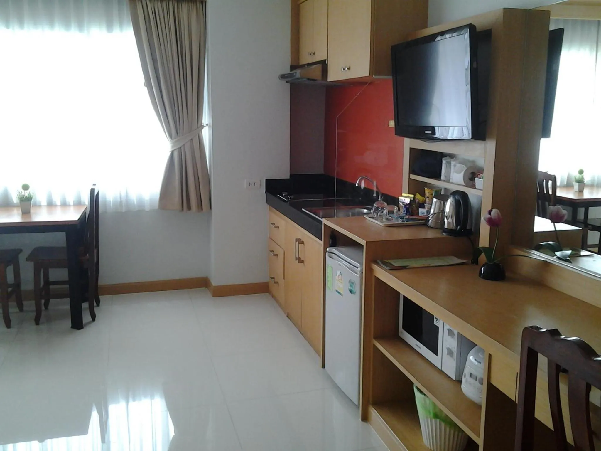 Kitchen or kitchenette in Green Harbor Hotel & Service Apartment