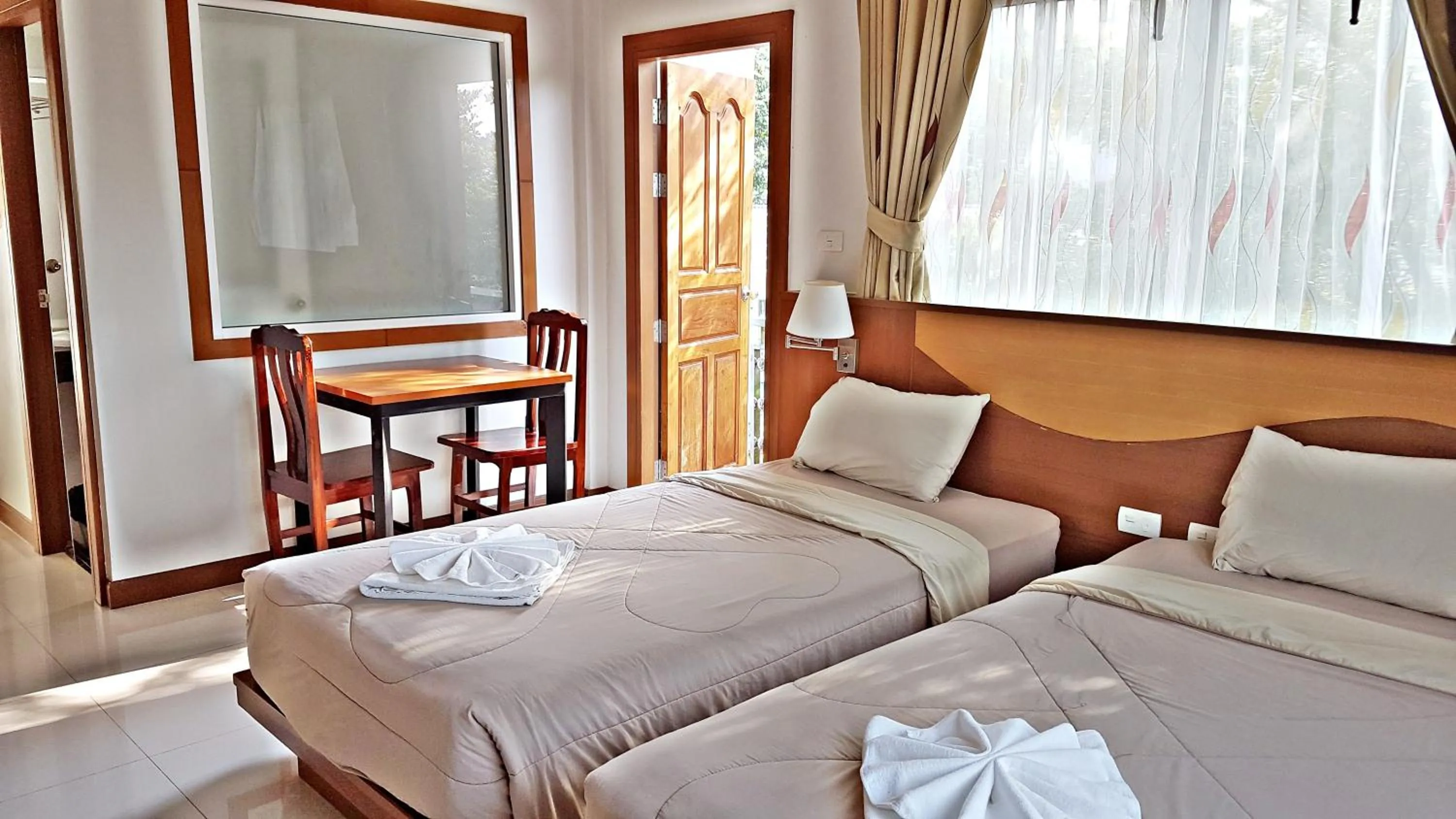 Bed in Green Harbor Hotel & Service Apartment