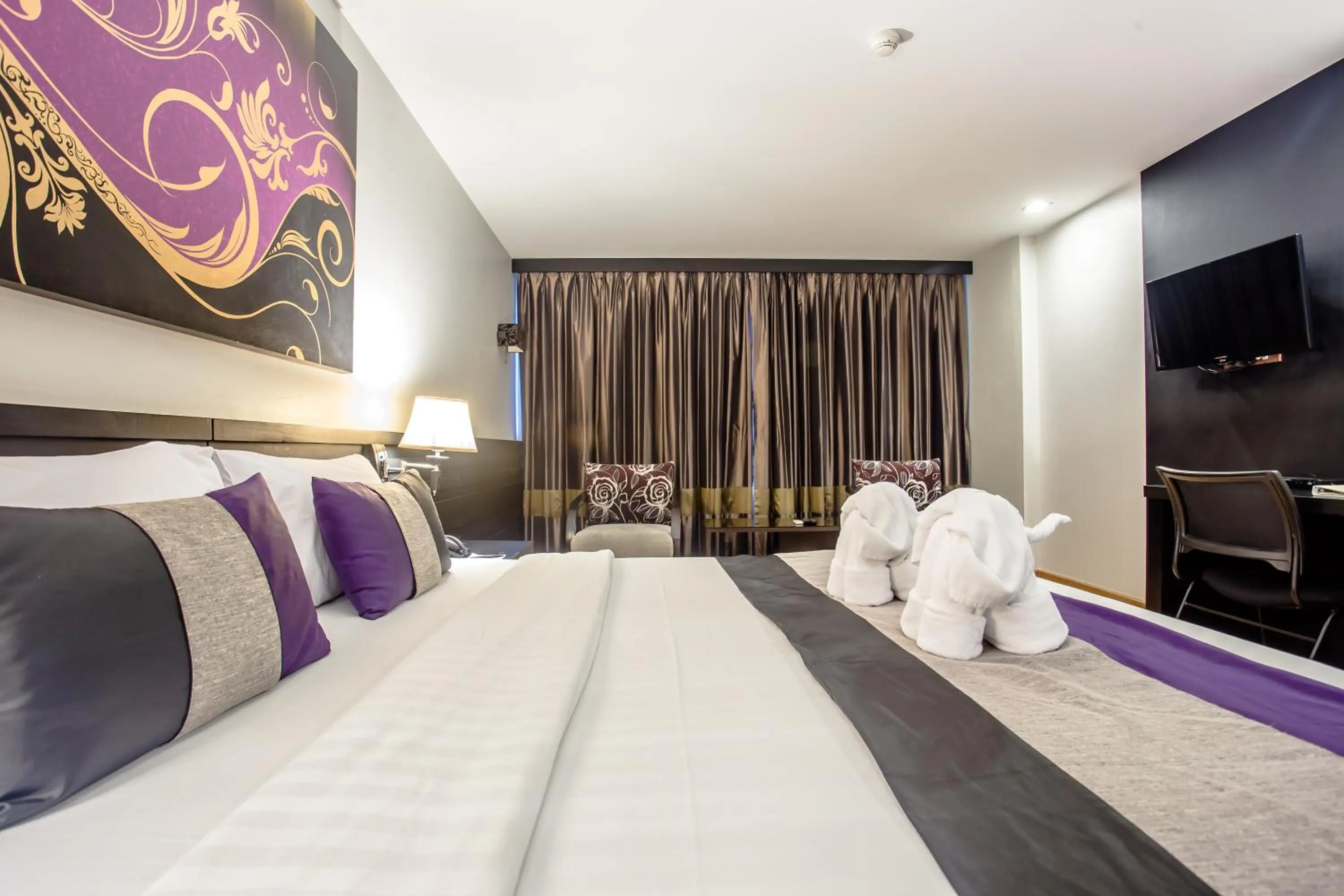 Photo of the whole room, Bed in Nouvo City Hotel