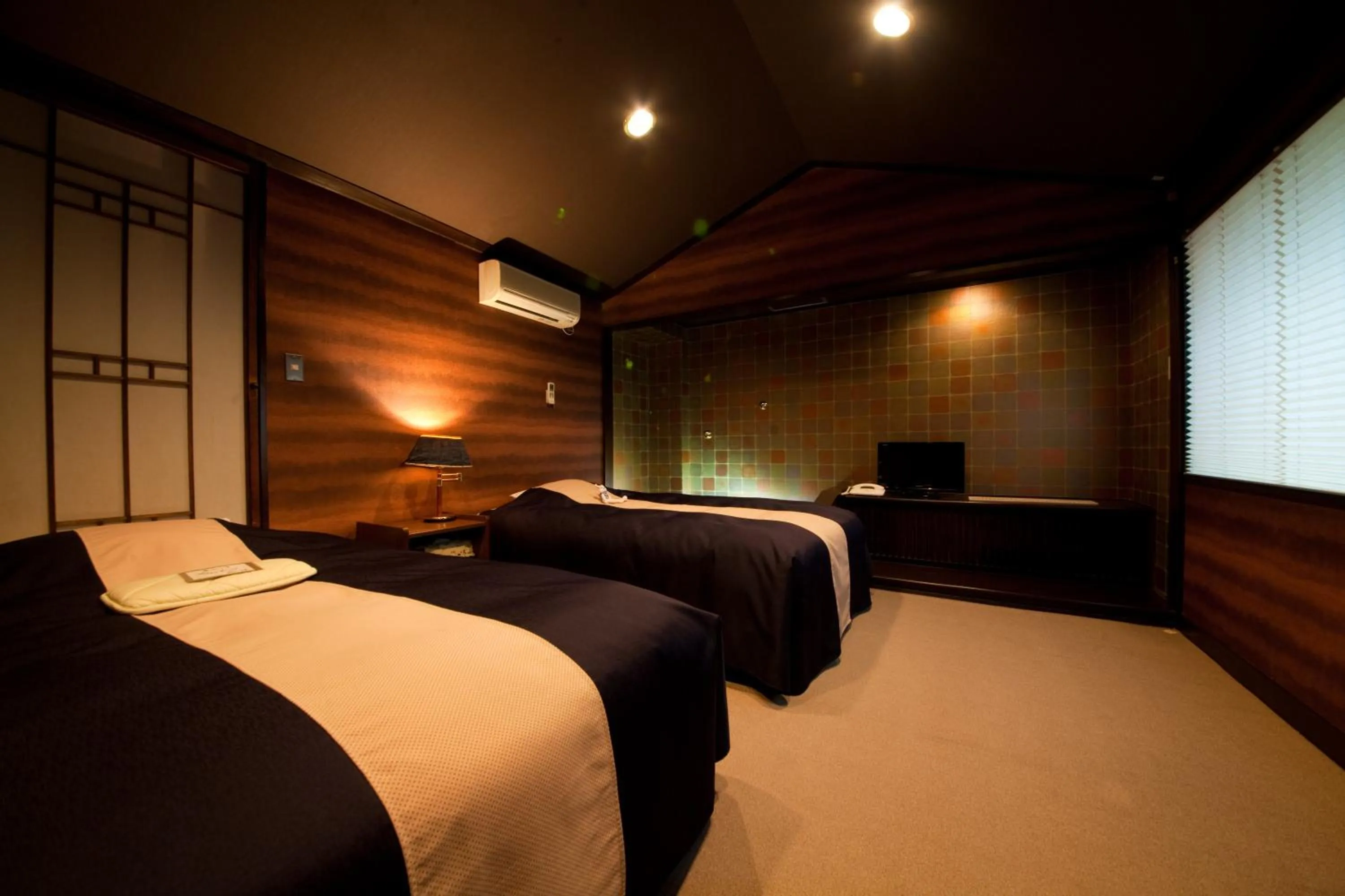 Bed in Yufuin Kaorinosato Hanamura