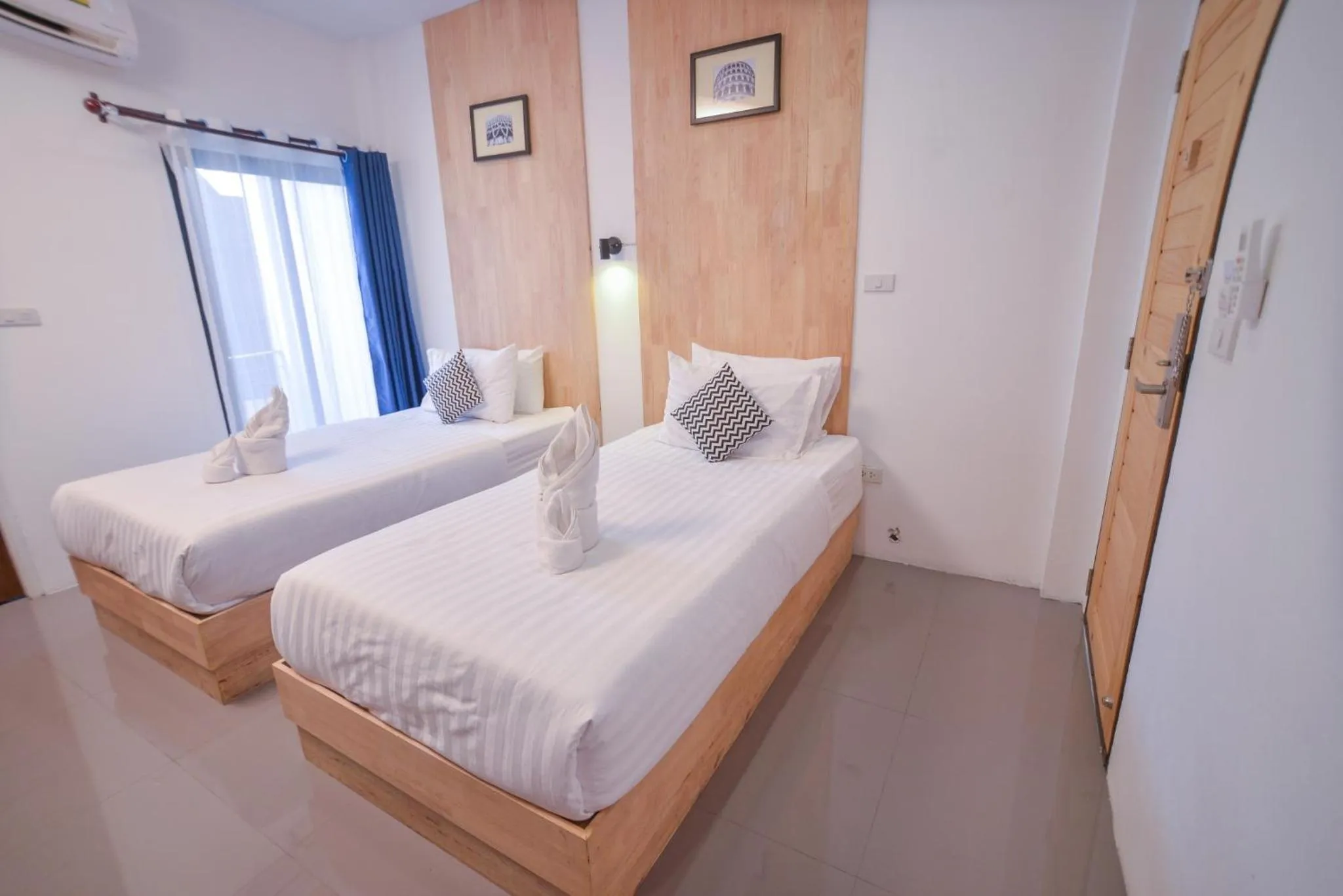 Bed in The Cozy Hotel