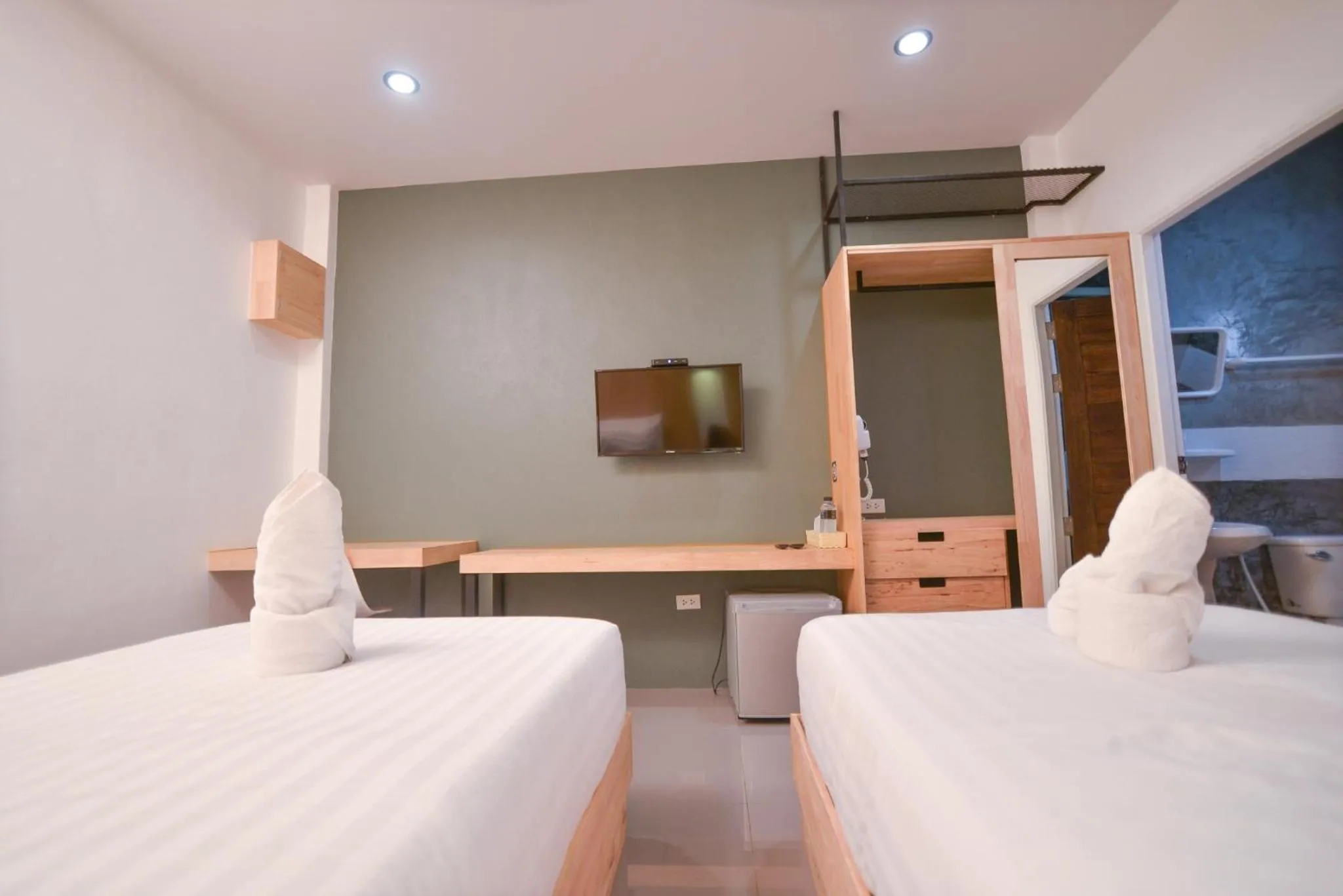 Bed in The Cozy Hotel