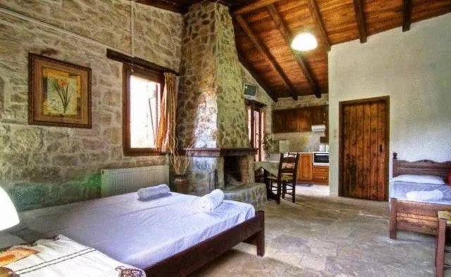 Bed in Stone Village Hotel Apartments