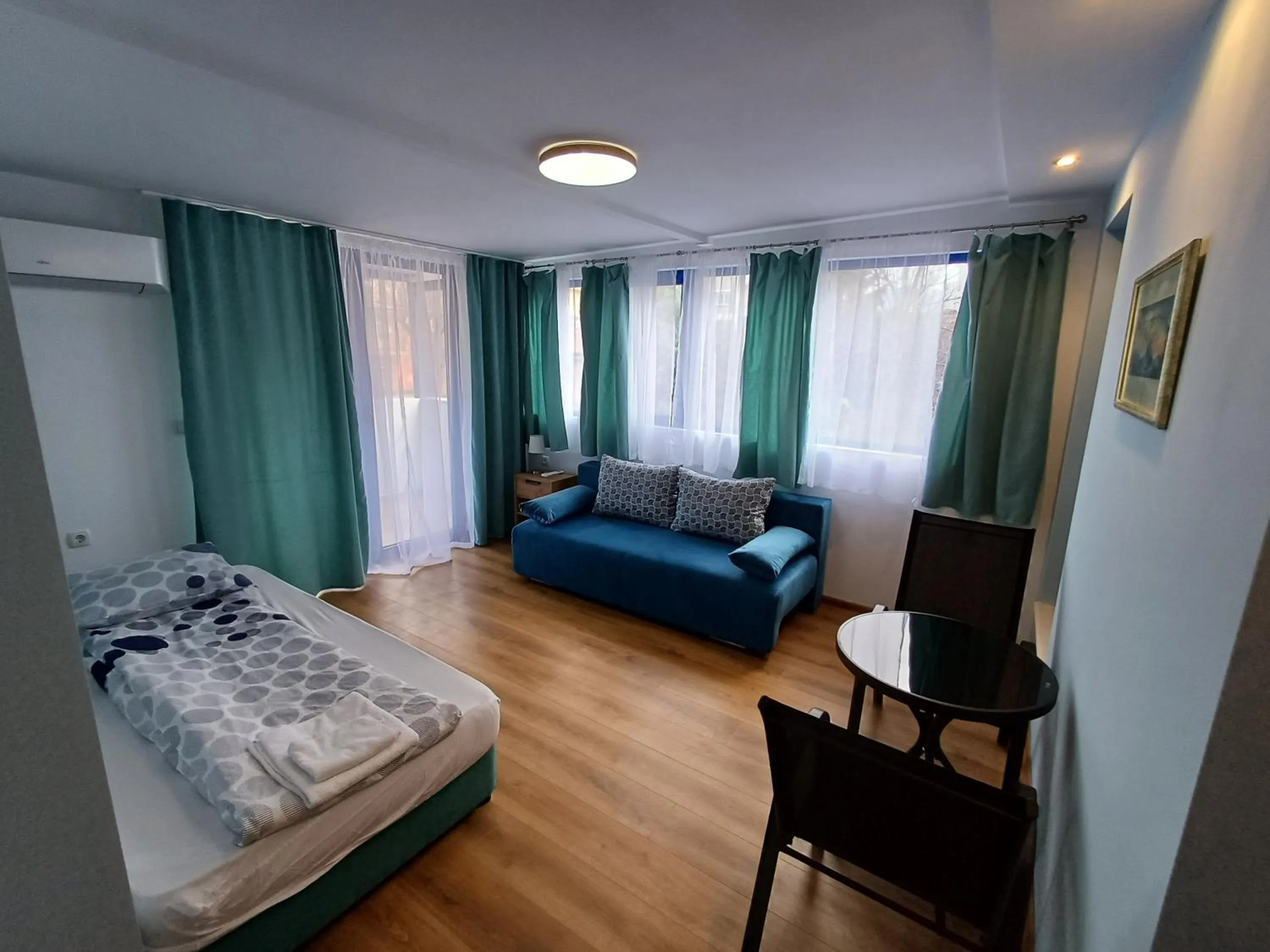 Living room, Bed in Fenix Family Hotel