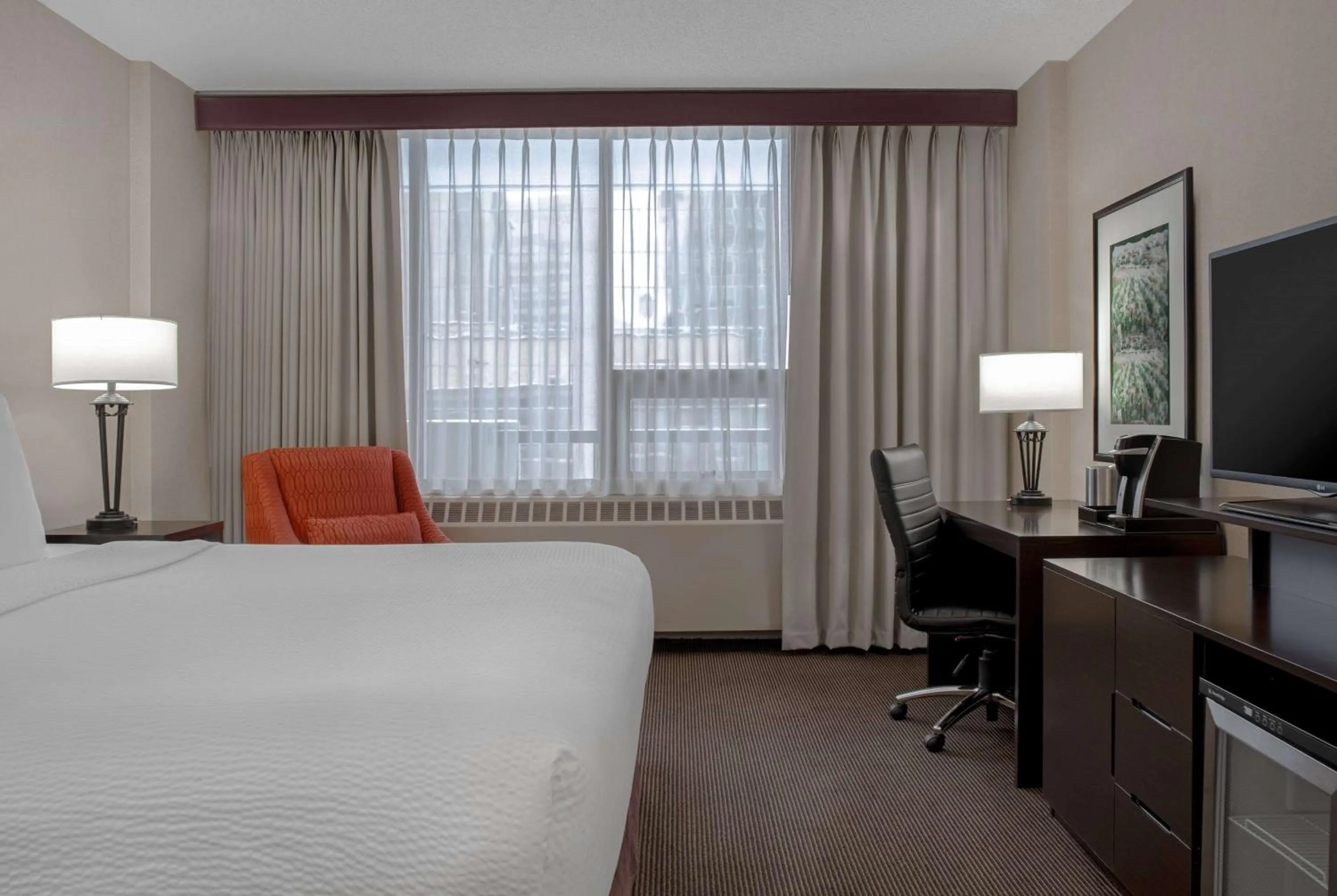 Photo of the whole room, Bed in Ramada Plaza by Wyndham Calgary Downtown