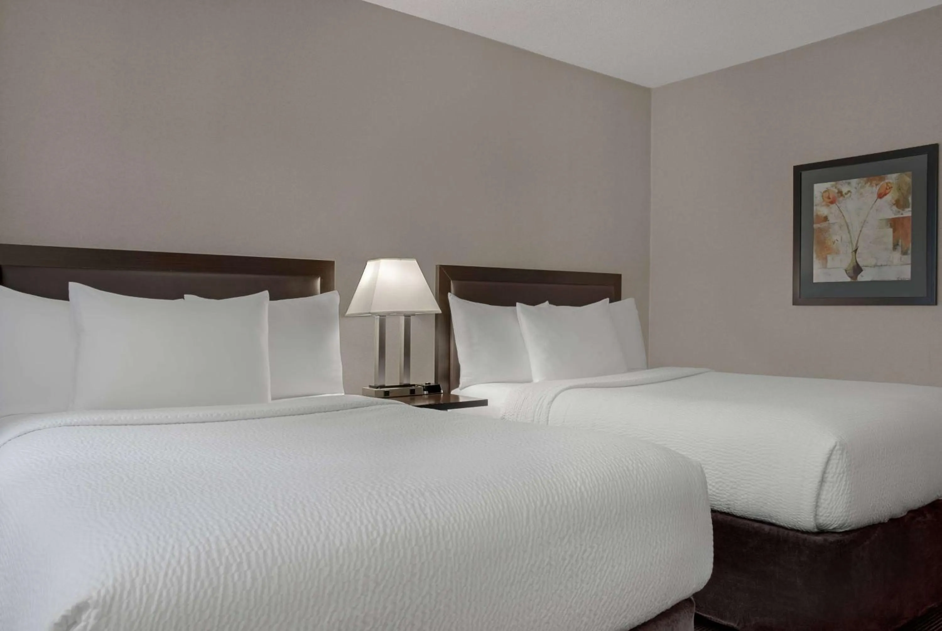 Photo of the whole room, Bed in Ramada Plaza by Wyndham Calgary Downtown