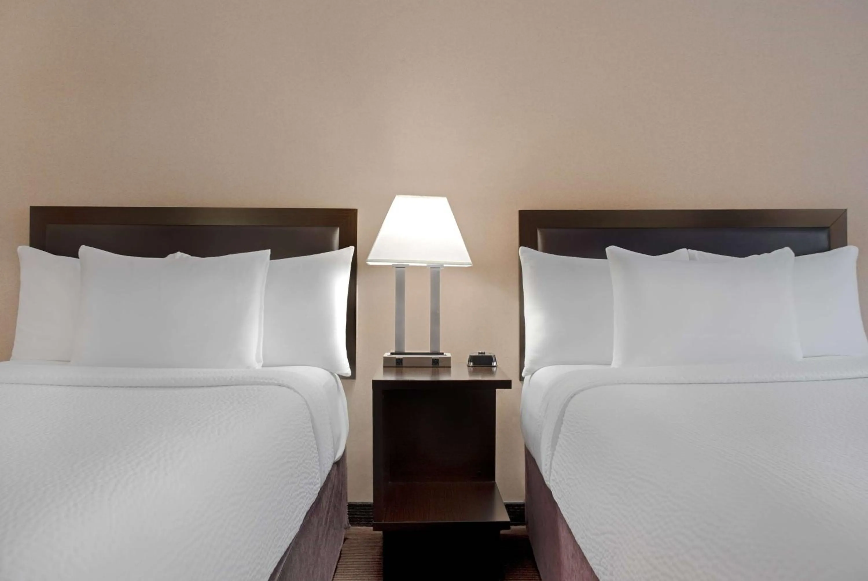 Photo of the whole room, Bed in Ramada Plaza by Wyndham Calgary Downtown