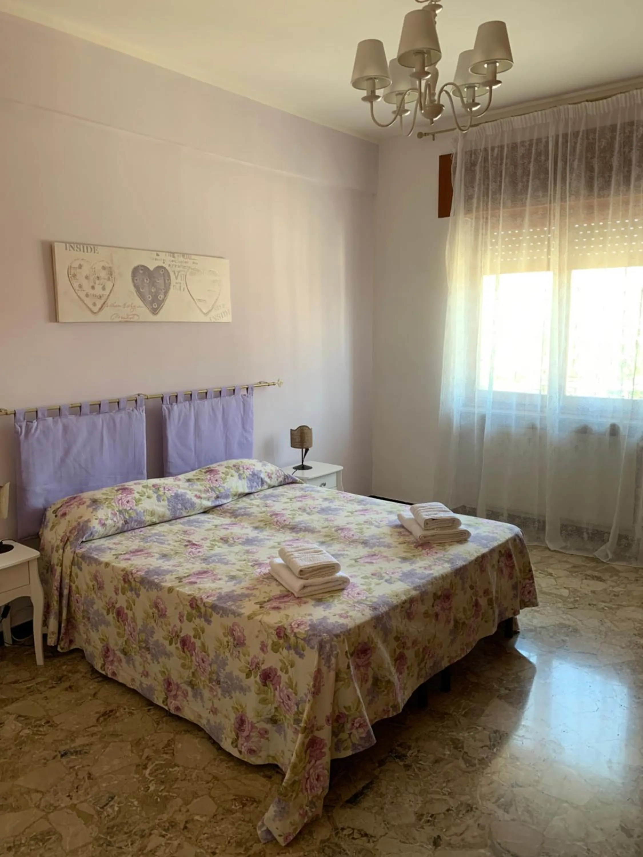 Bedroom in Affittacamere Serravalle Shopping