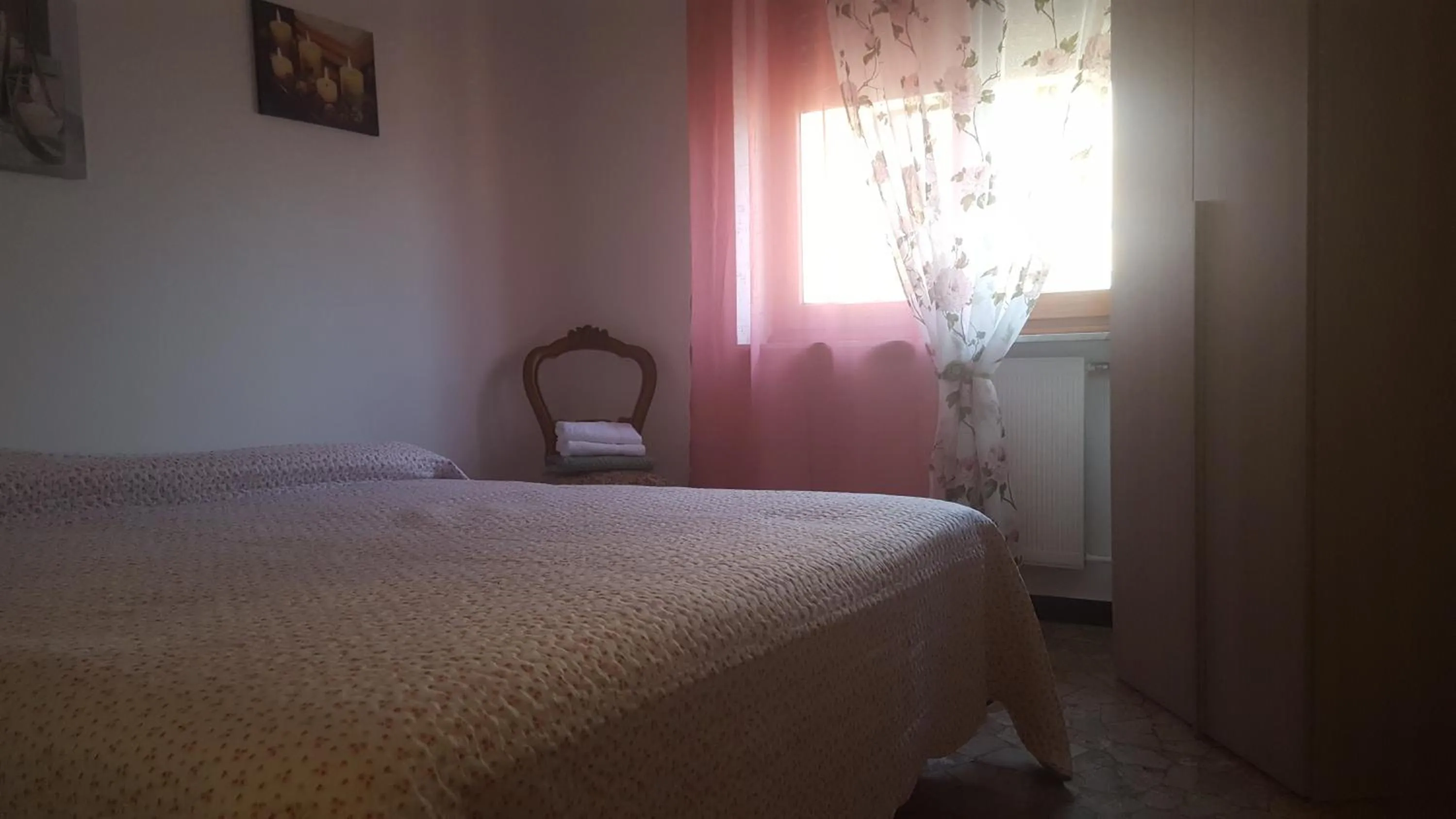 Bedroom in Affittacamere Serravalle Shopping