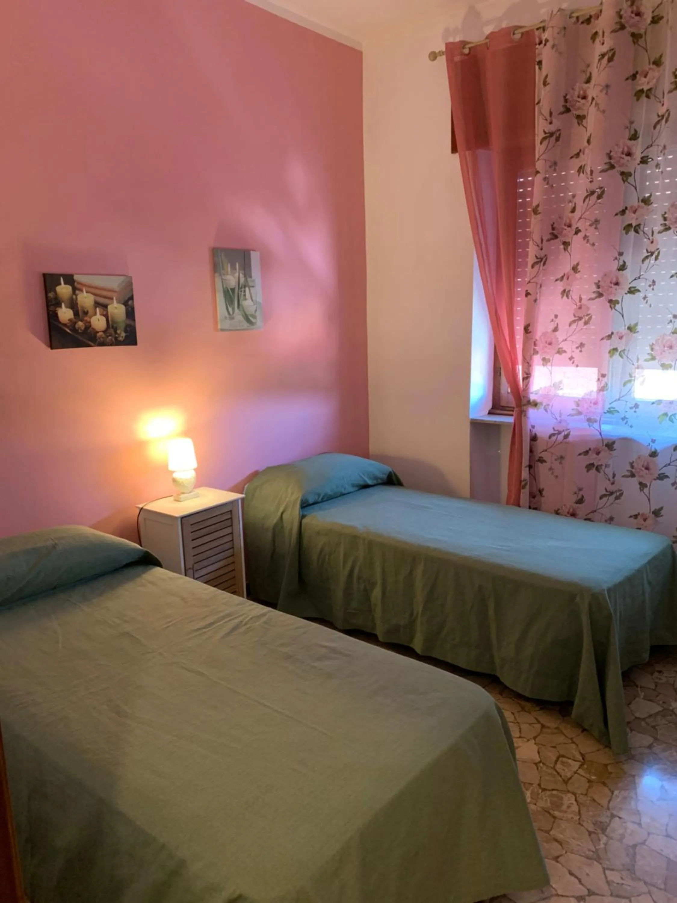 Bedroom in Affittacamere Serravalle Shopping