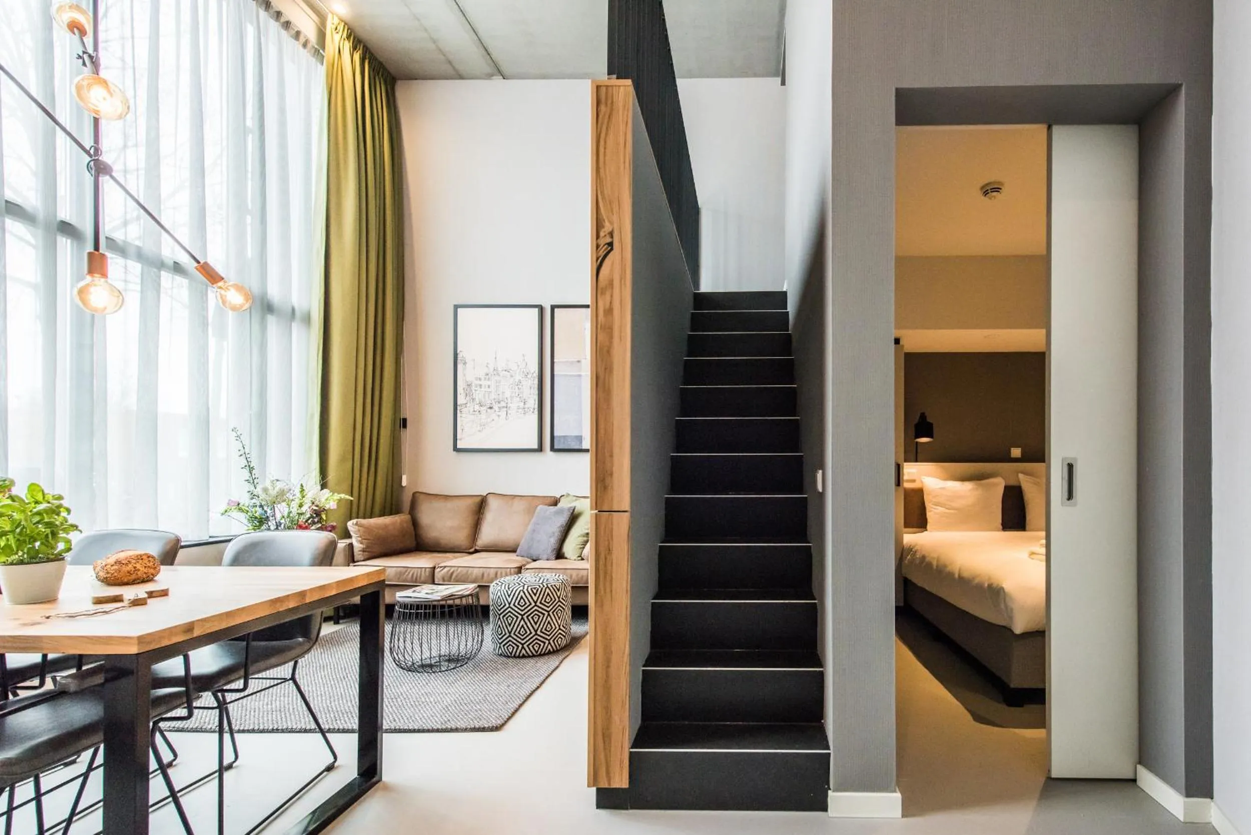 Living room, Bed in YAYS Amsterdam East by Numa